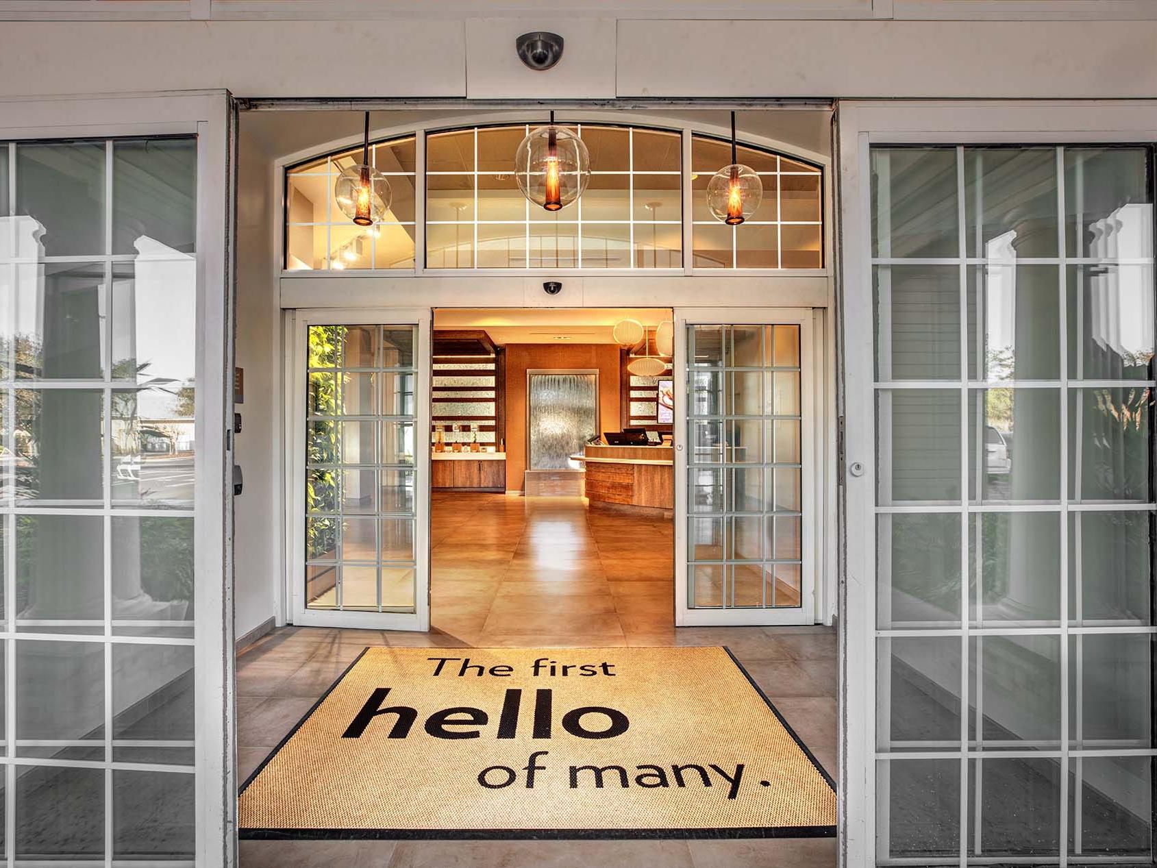 EVEN Hotel Sarasota-Lakewood Ranch entrance with hello welcome mat