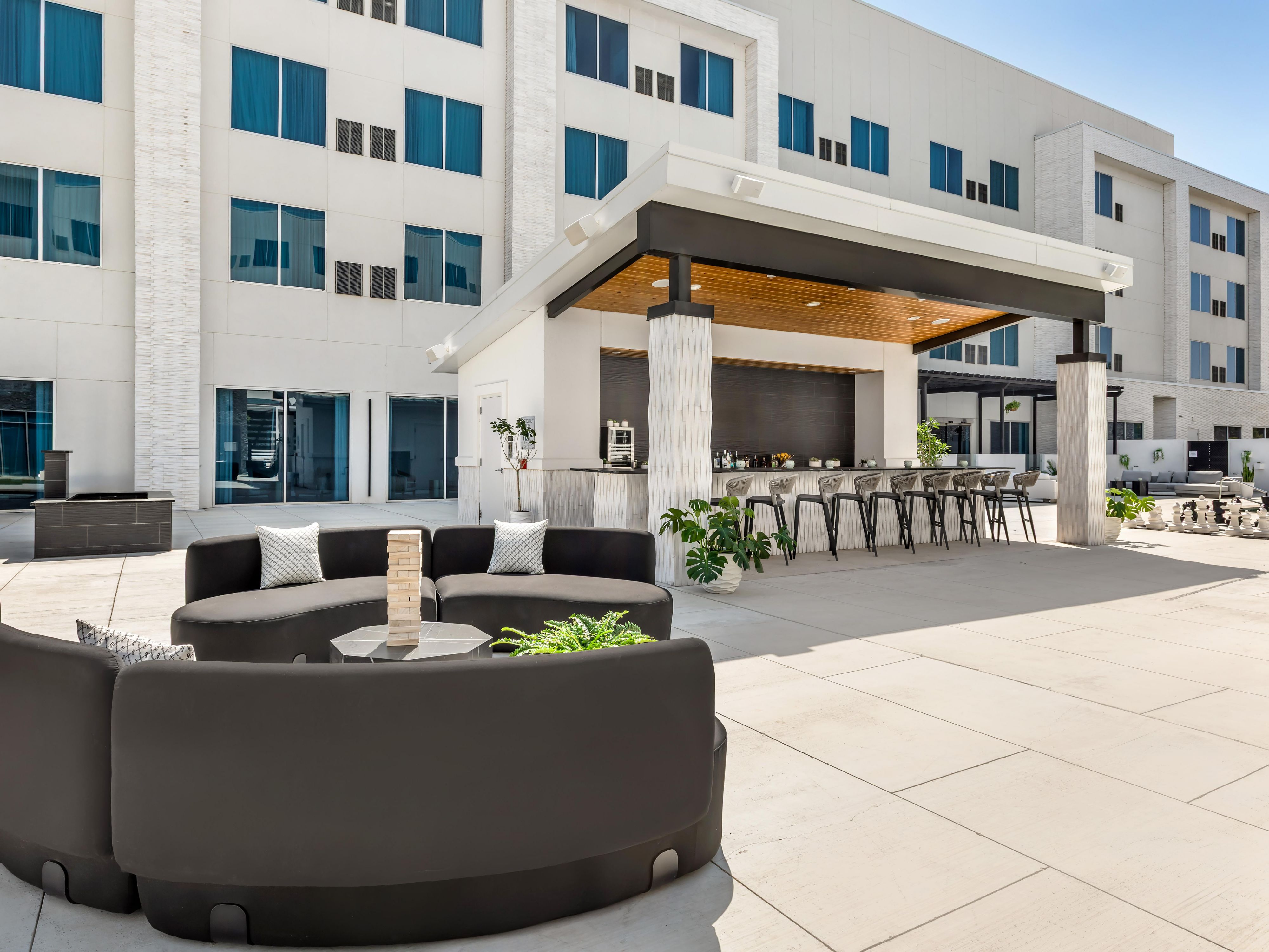 Soak up the Texas sunshine in our spacious outdoor courtyard, designed for connection and fun. Challenge friends to giant Jenga, oversized chess, shuffleboard, or ping pong. Kick back in a comfy lounge chair with a refreshing drink. It's the perfect place to pause, play, and soak in the good vibes.