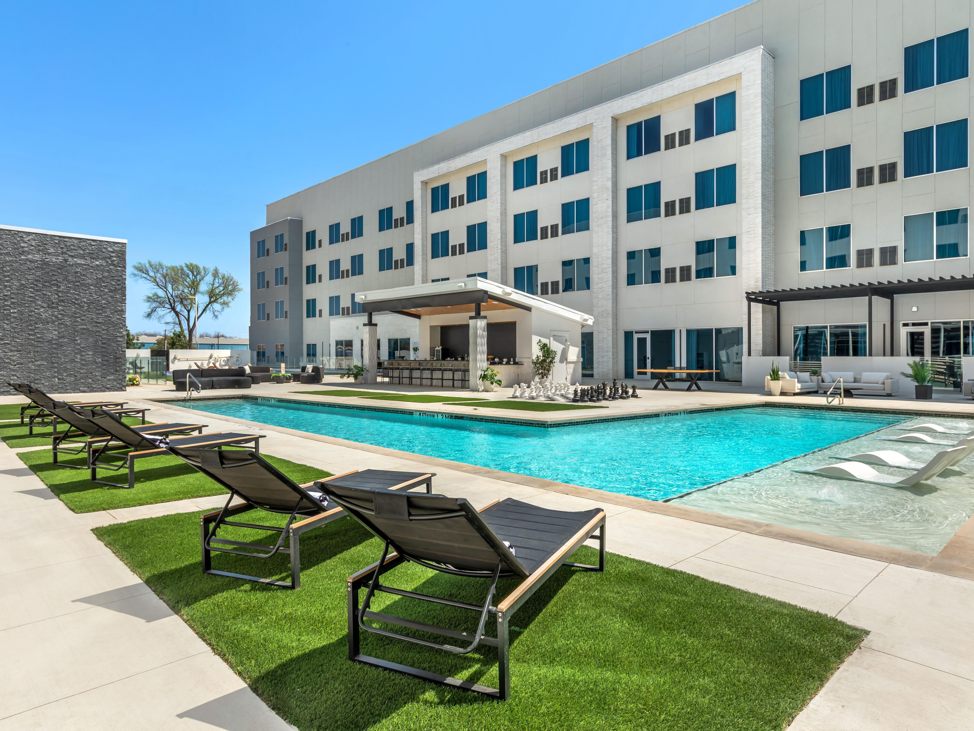 Soak up the sun at our Waco hotel, where two refreshing pools offer something for every mood. Lounge in the resort-style pool with a relaxing Baja shelf, swim a few energizing lengths in the separate lap pool, or unwind in the hot tub under the open Texas sky. Plus, on weekends, enjoy cocktails at the poolside bar.
