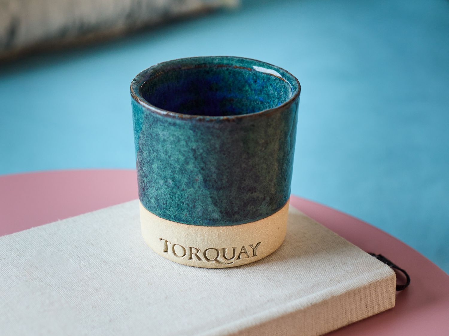 blue ceramic pot with a notebook