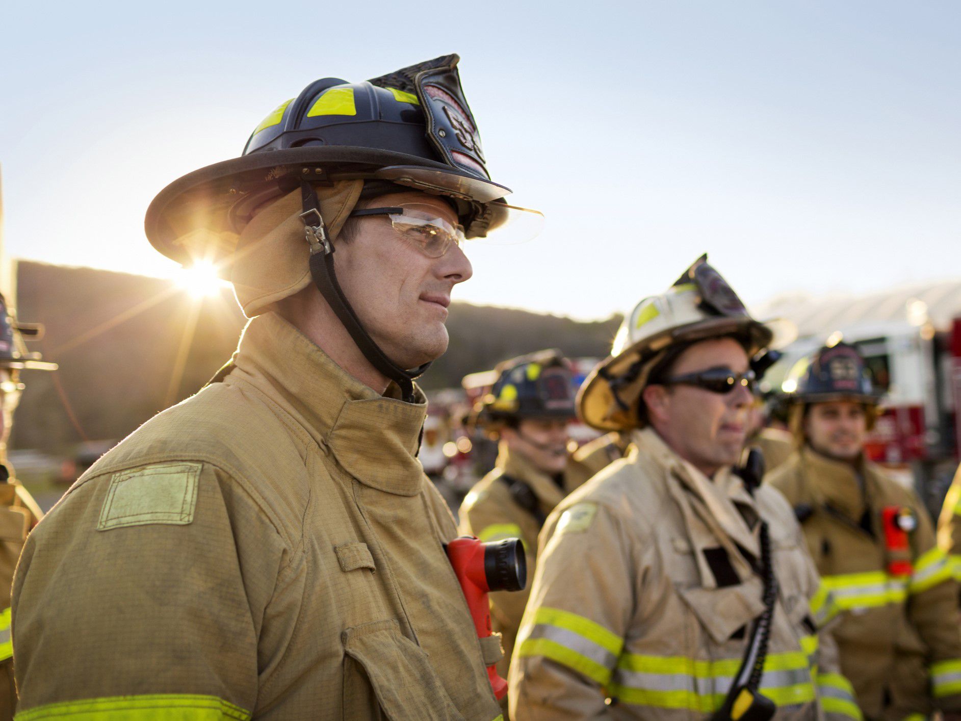 Two firefighters in full uniform