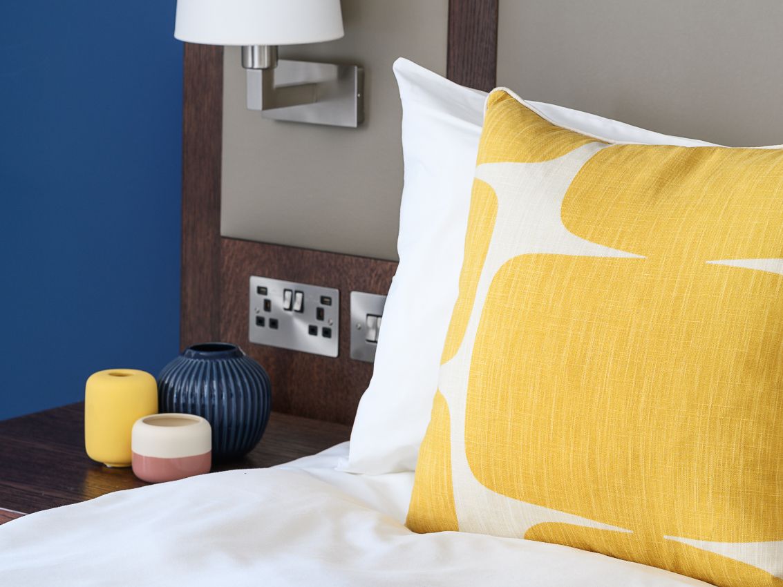 Hotel bed with decorative pillows