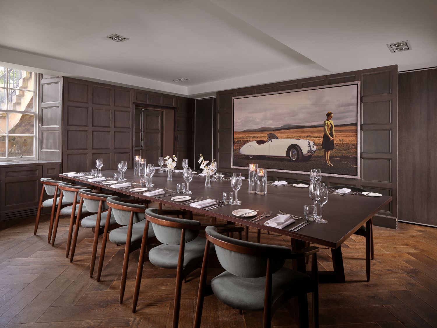 Empty luxury hotel meeting room with chairs surrounding a large table