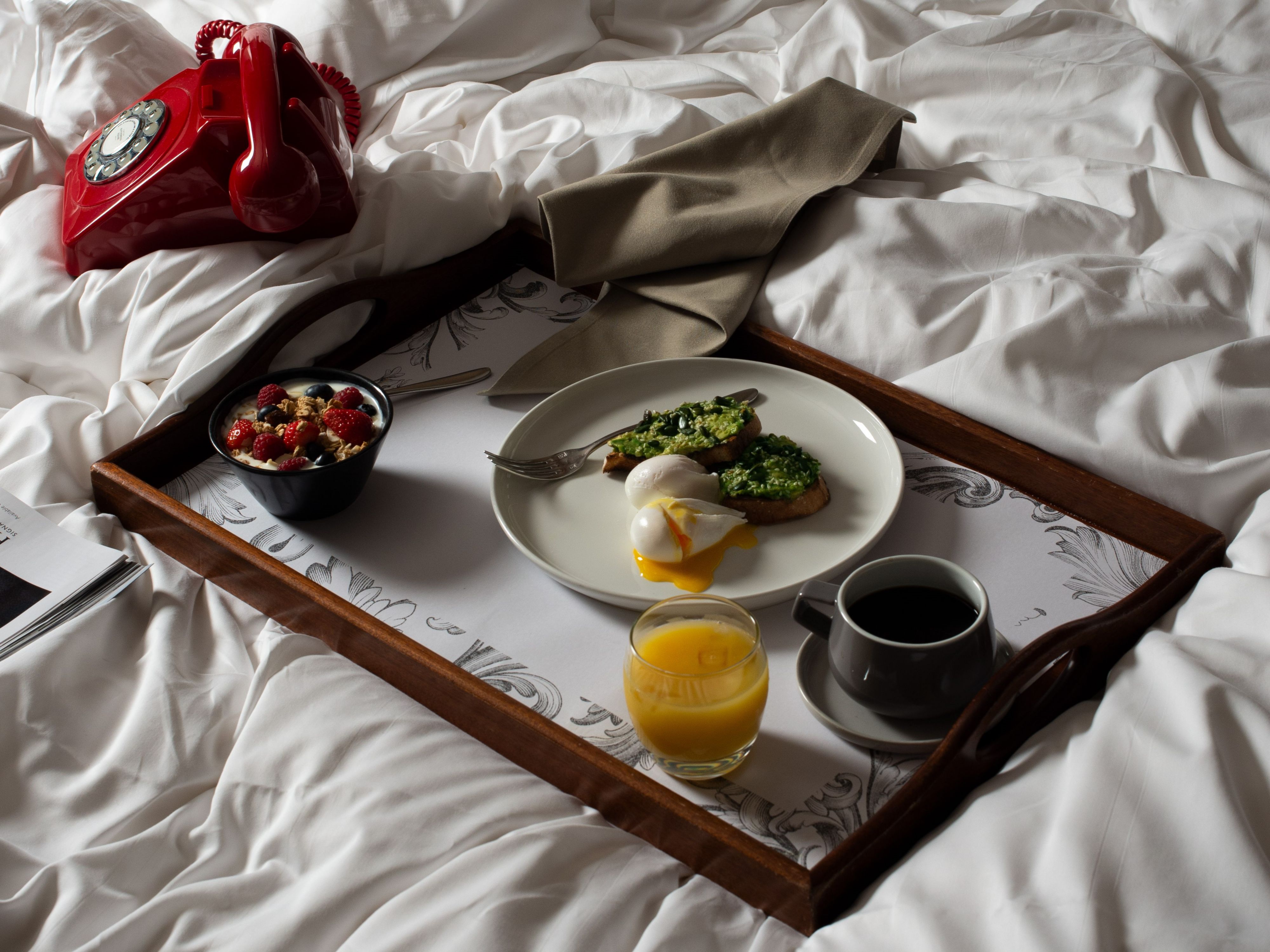 Room service meal on a bed