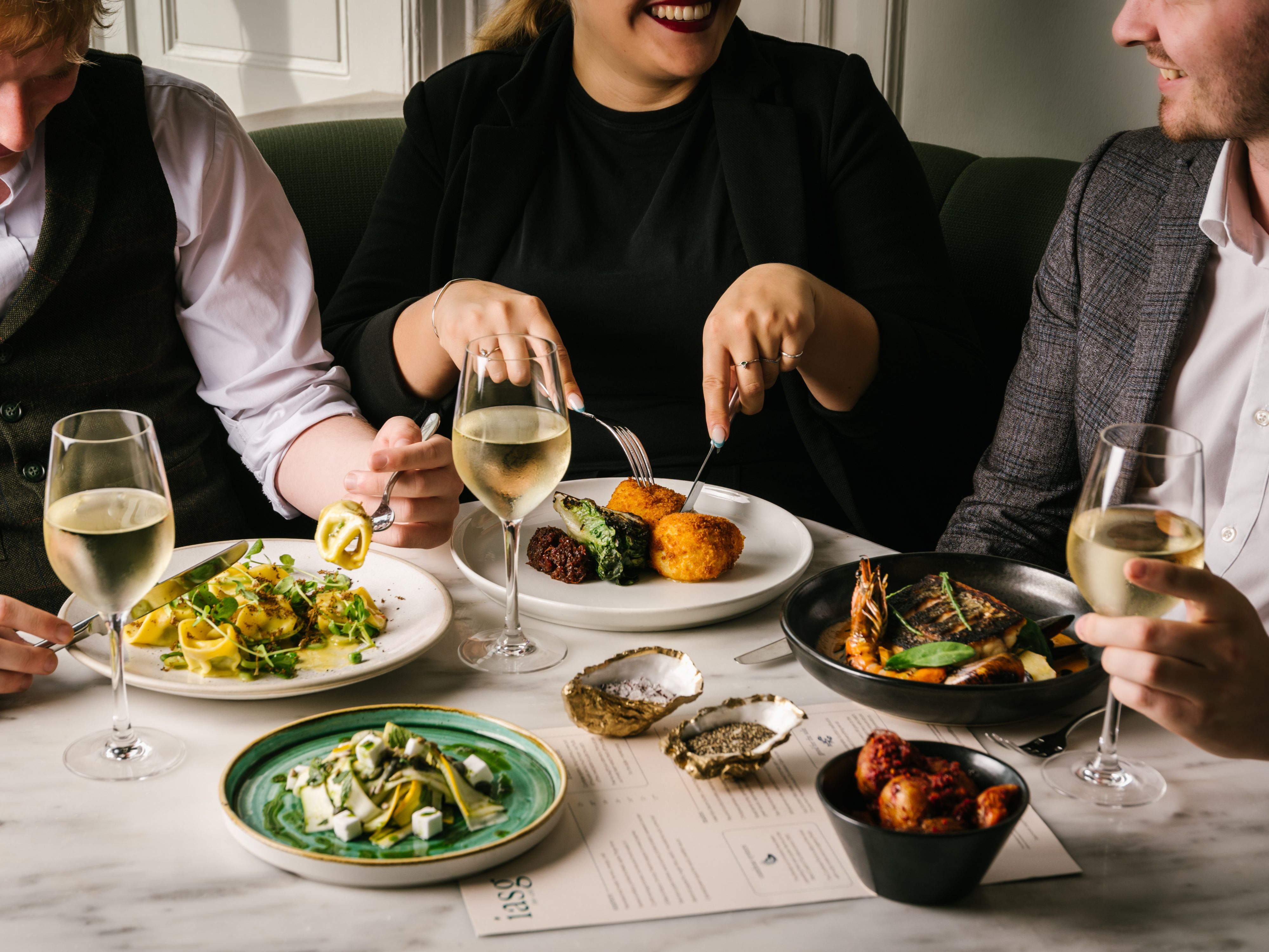 Colleagues eating and drinking