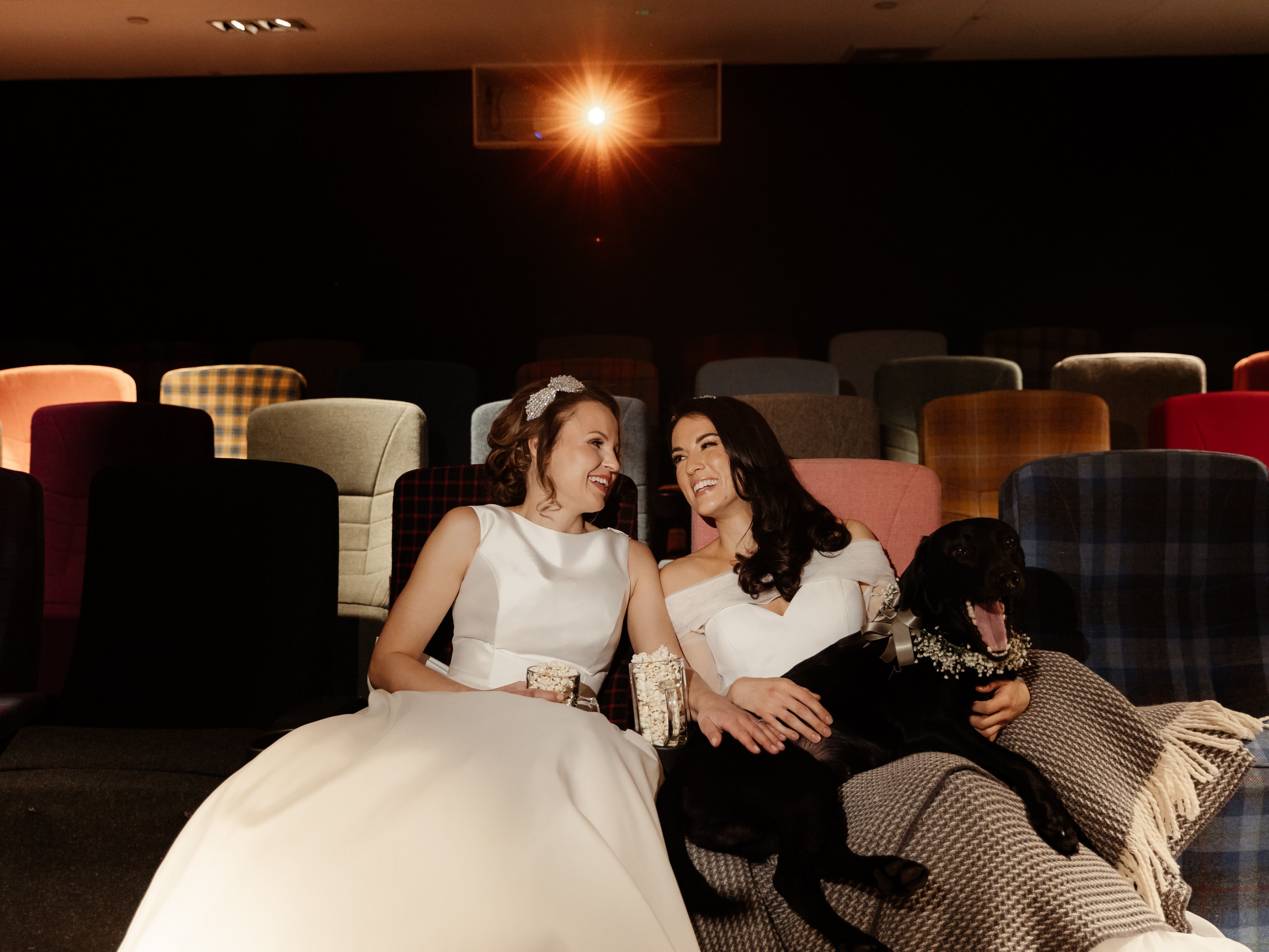 Bride and bridesmaid relaxing in the theatre room