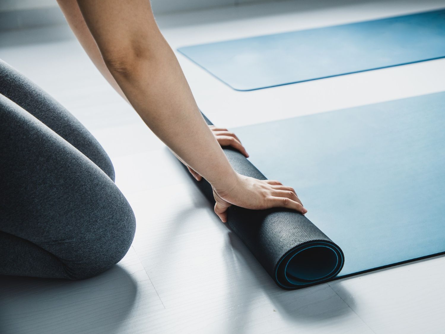 rolling up a yoga matt