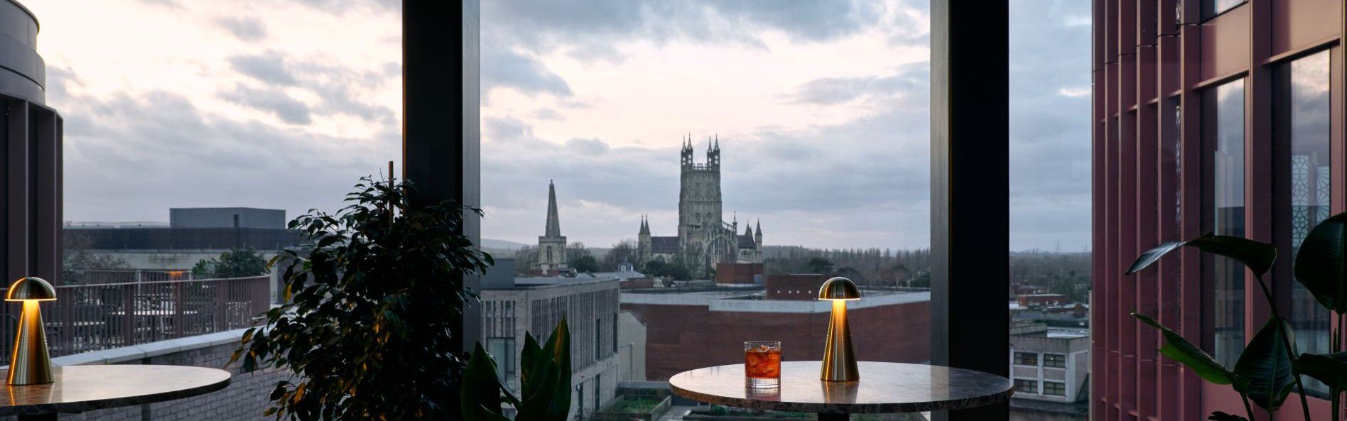 events facility with large windows offering city skyline views and bright natural lighting