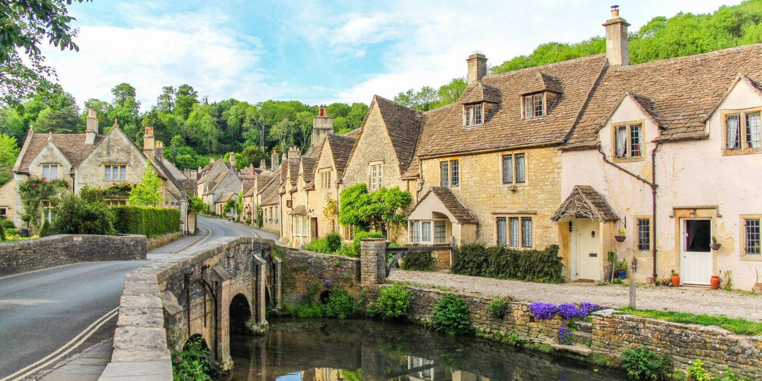 A picturesque view of cottages with Cotswold stone walls in Cotswolds, England
