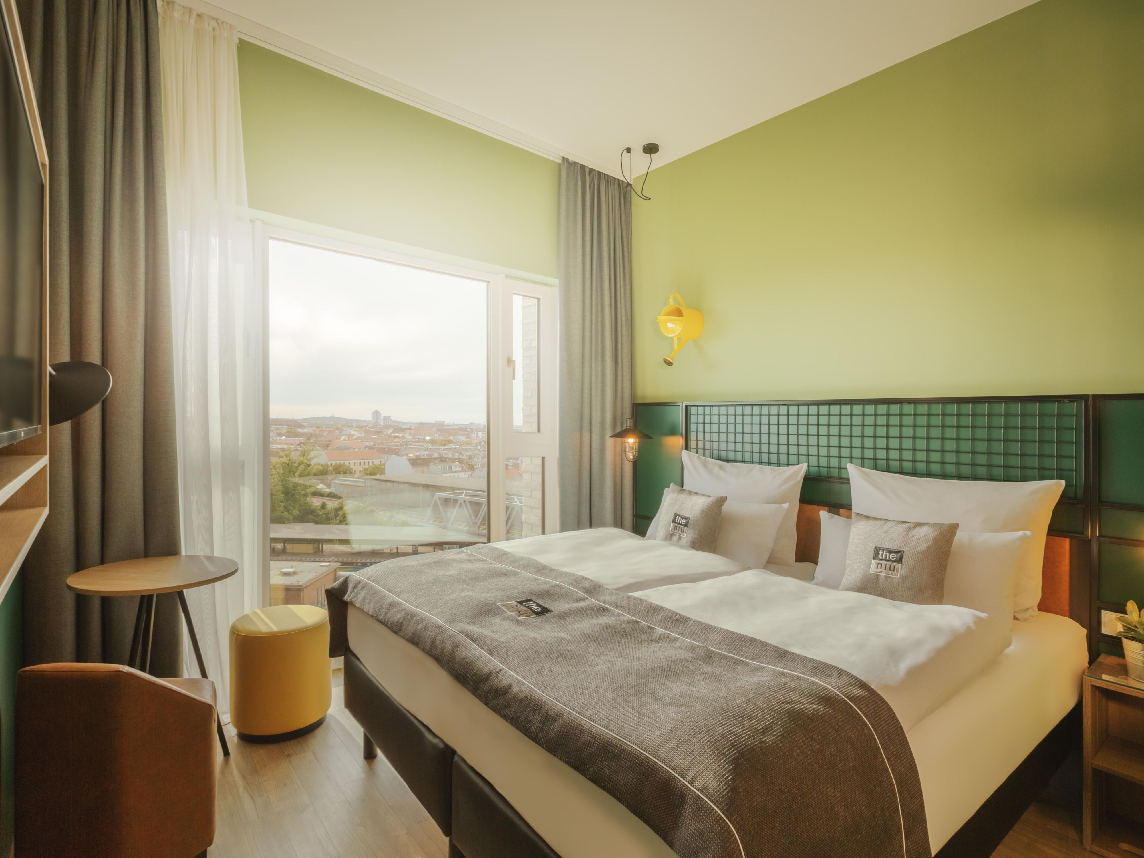 All our rooms are designed for ultimate comfort with modern amenities. Enjoy a Smart TV, USB ports, invisible sound system, and free Wi-Fi. Soundproof windows ensure peace and quiet, even though we’re close to transport links. Plus, many rooms offer stunning views of Berlin’s skyline, making your stay even more special.