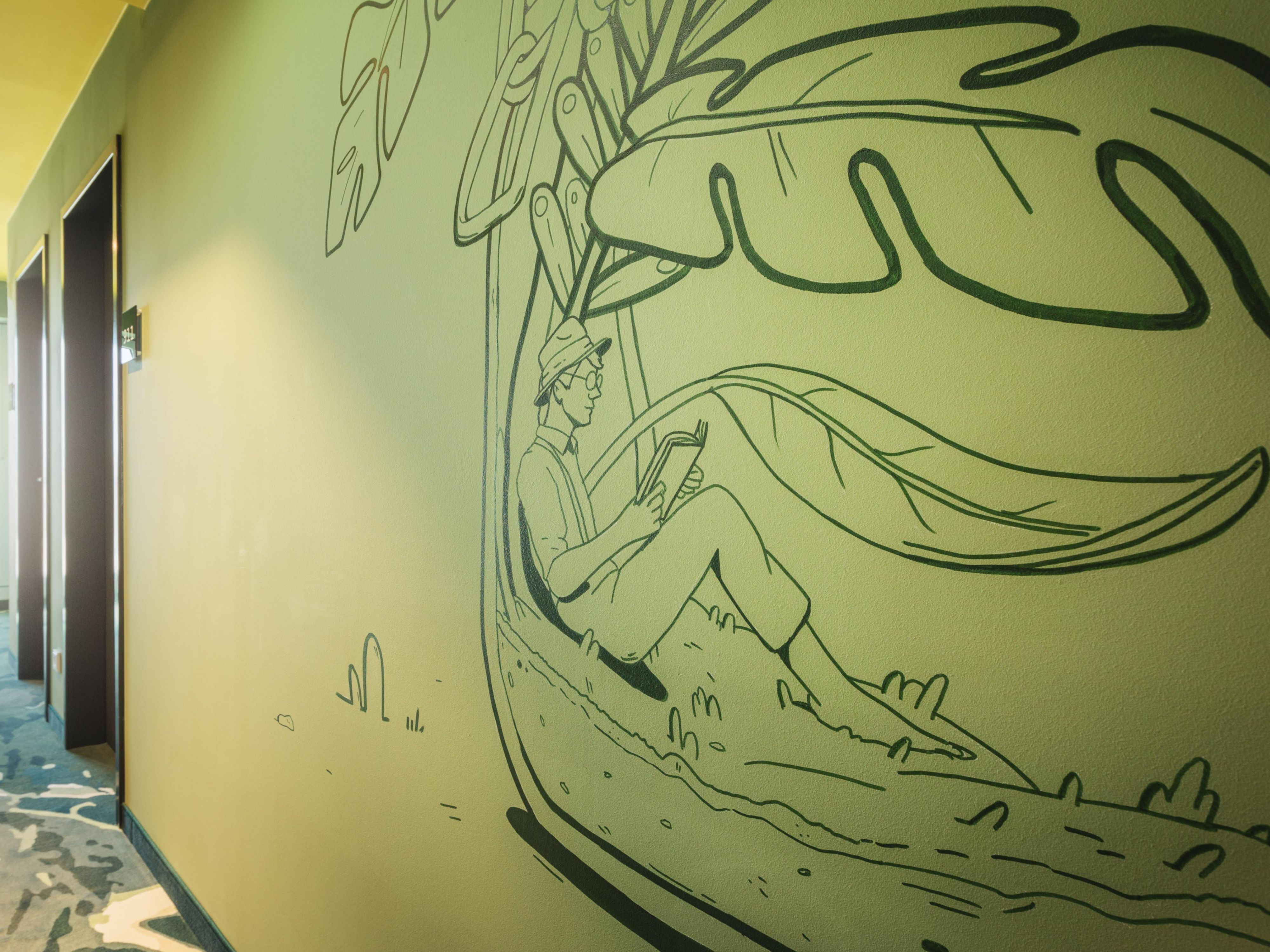 Subtle wall art in greens adds to the allotment vibe of our hotel