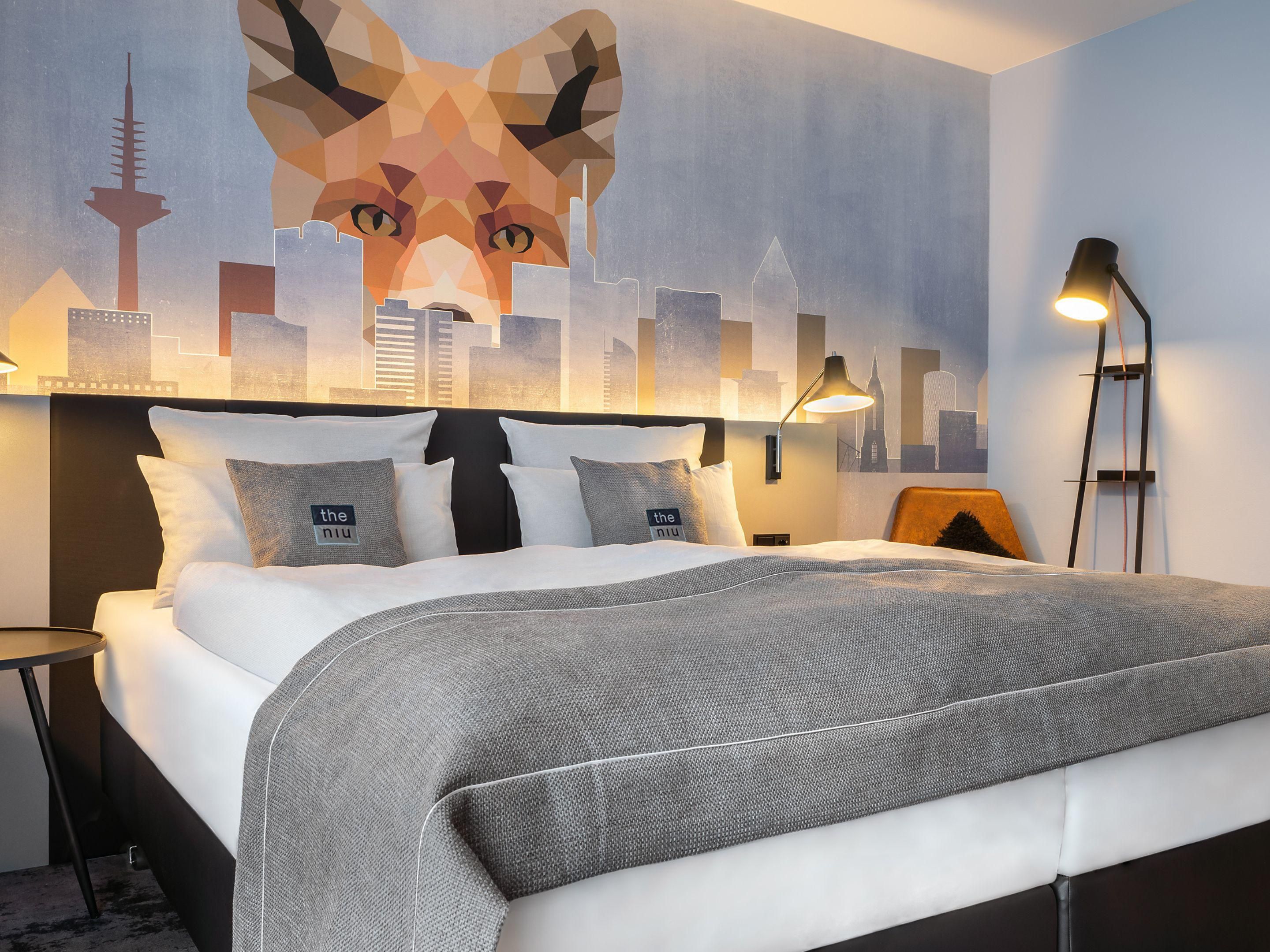 Stylish hotel rooms with warm lighting and modern amenities