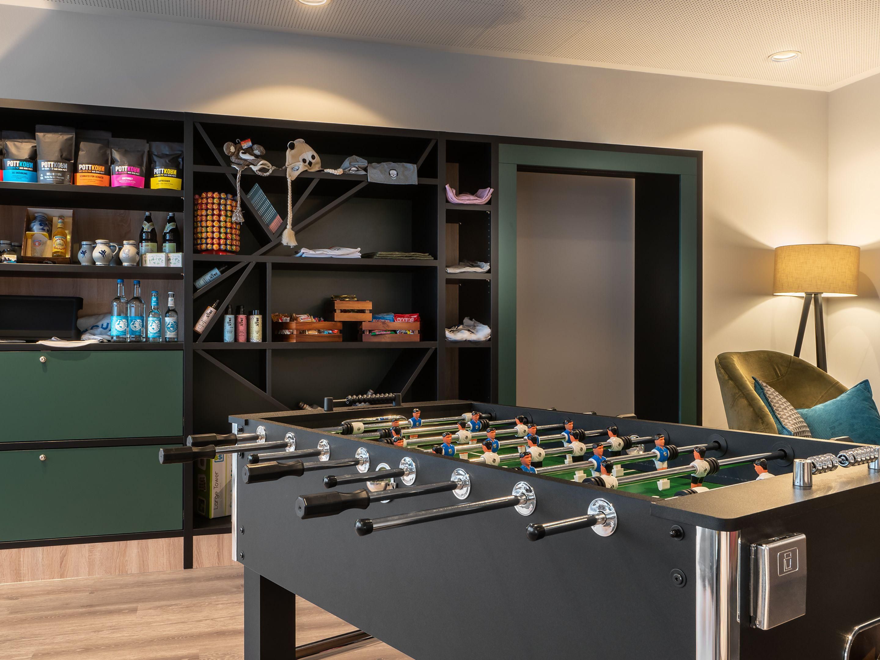 Lobby with a foosball table, lounge chairs, and delicious snacks