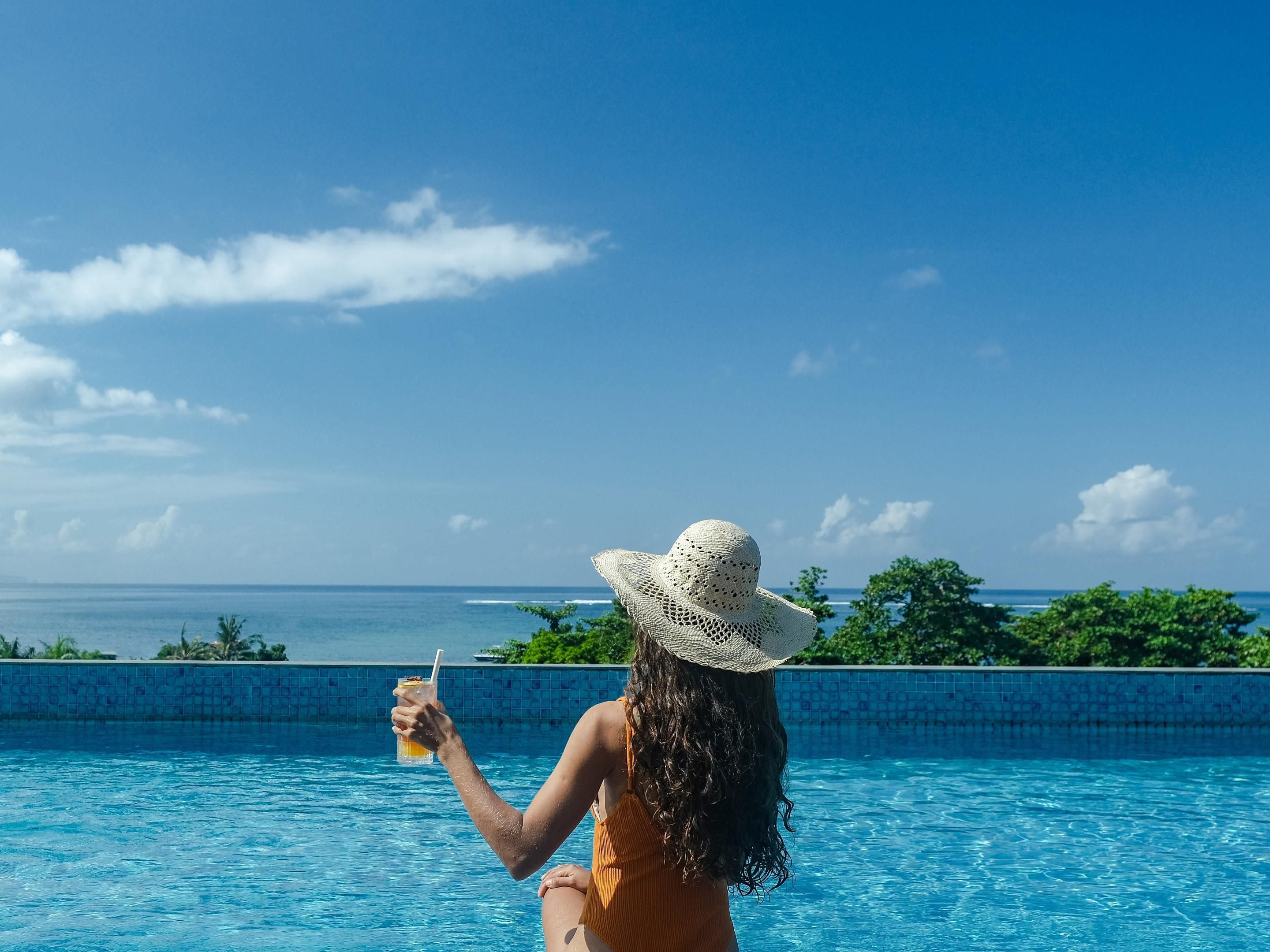 Relax by the pool overlooking the ocean