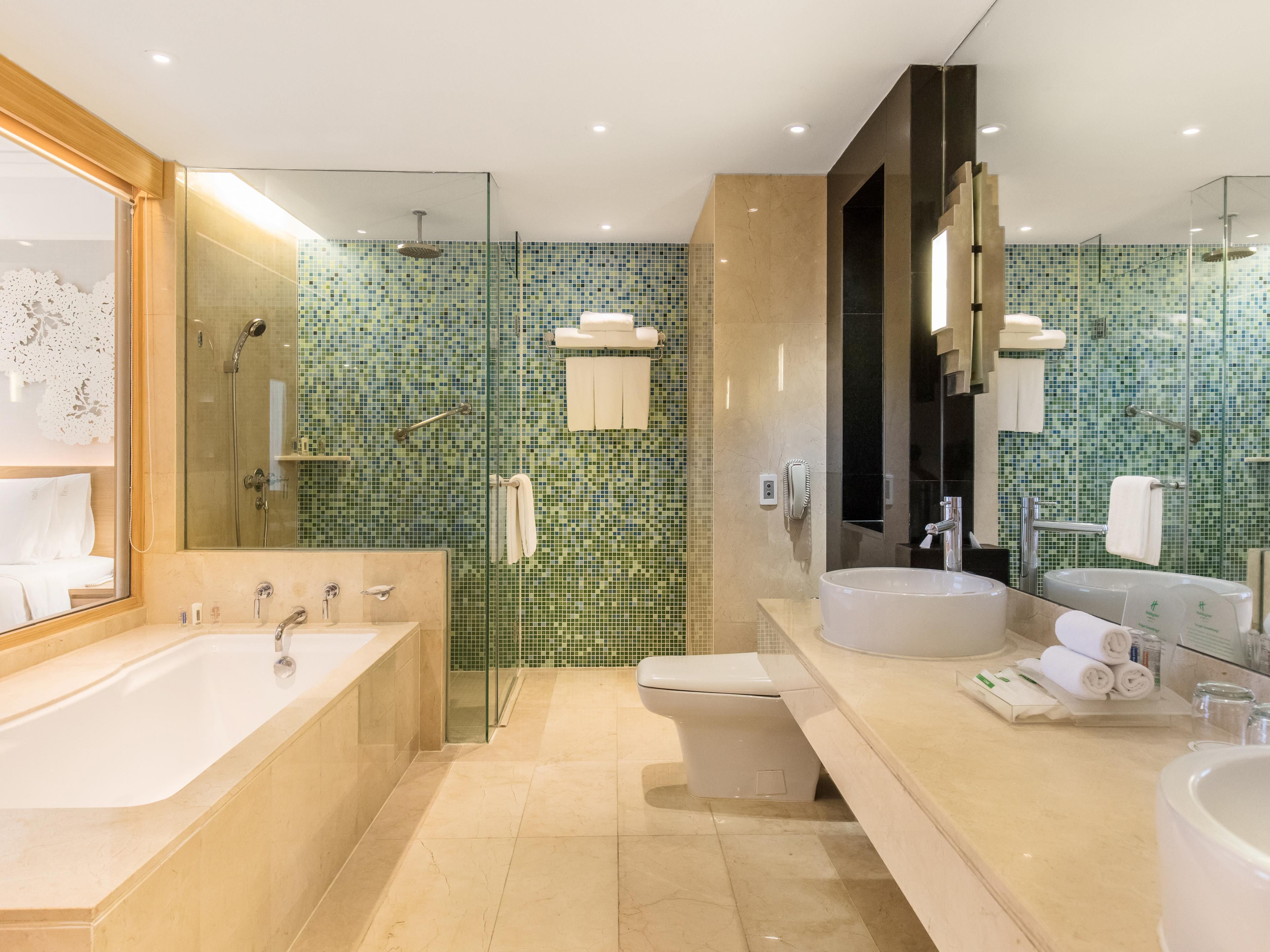 Our suite rooms at Holiday Inn Bangkok are equipped with both a walk-in shower and a bathtub, providing guests with options for ultimate comfort and relaxation during their stay.