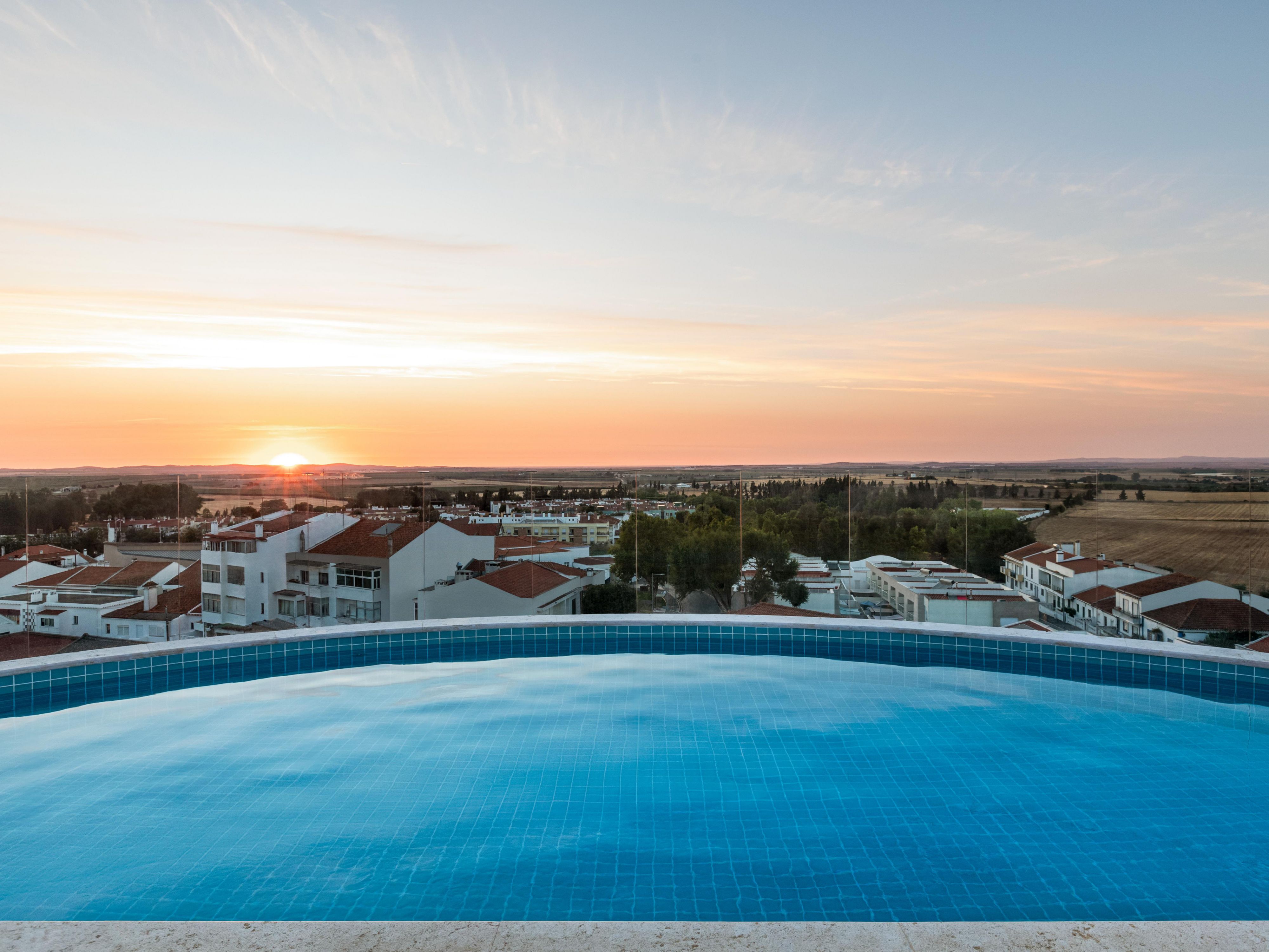Enjoy the sunset from the rooftop pool