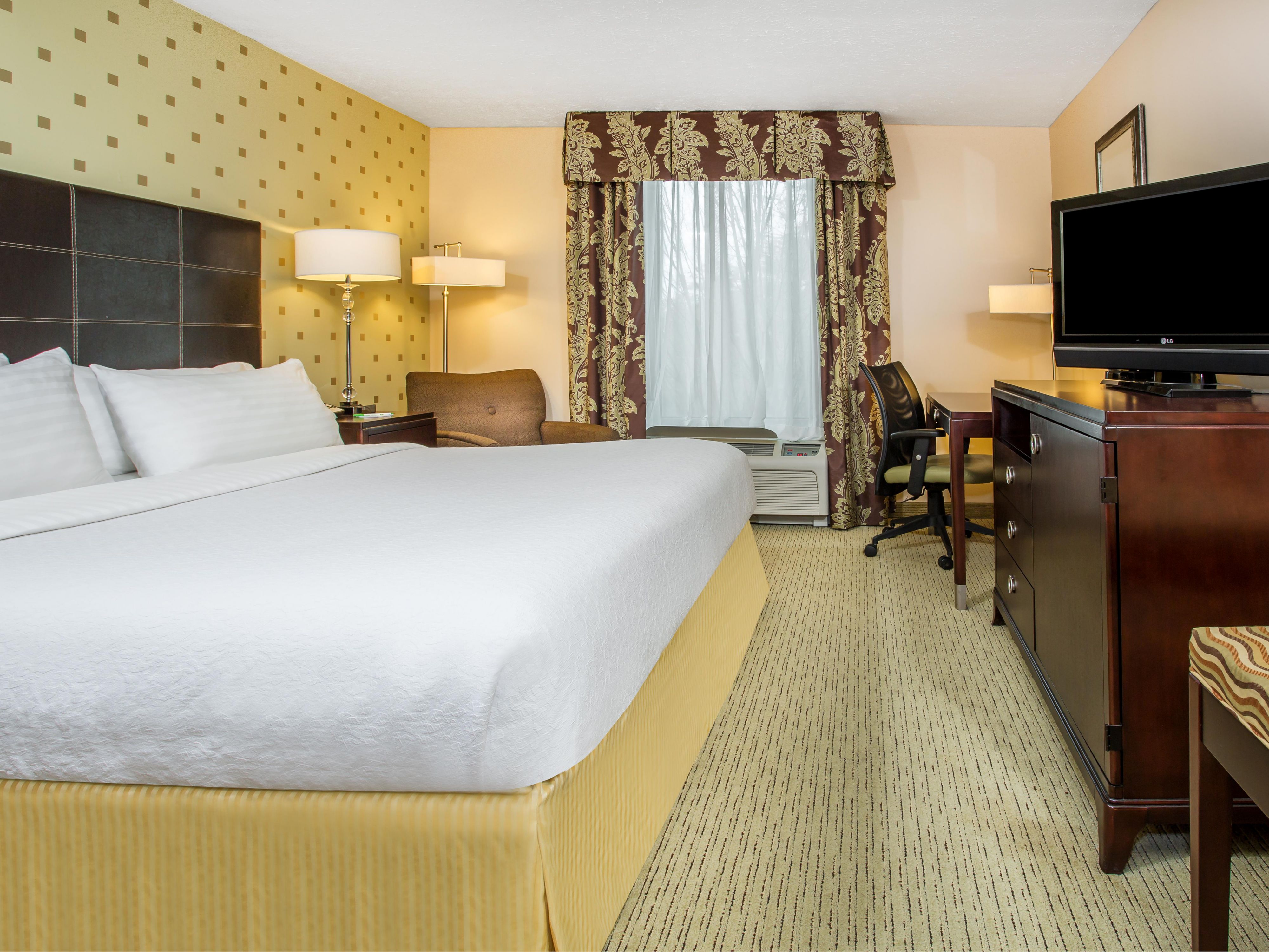Unwind in our spacious king guest room with thoughtful amenities.