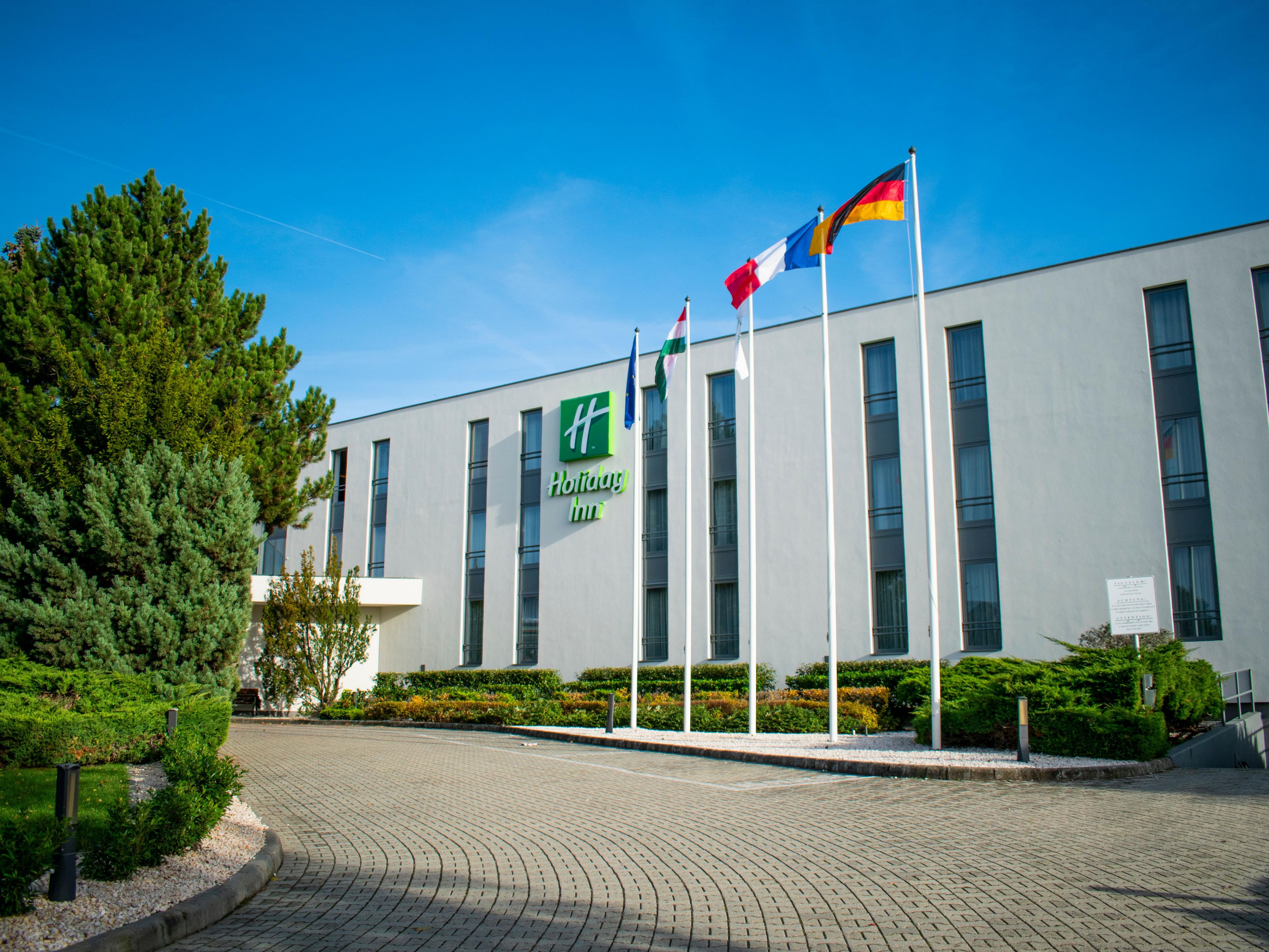 The Hotel is situated at the western gateway, outside to Budapest, offering excellent access from the M1 and M7 highways, which connect Budapest to Vienna. The Hotel is conveniently about a 15-minute drive from Budapest's City Centre, also just 2 stops away from Budapest Metro station, making it an ideal choice for both business and leisure travel.