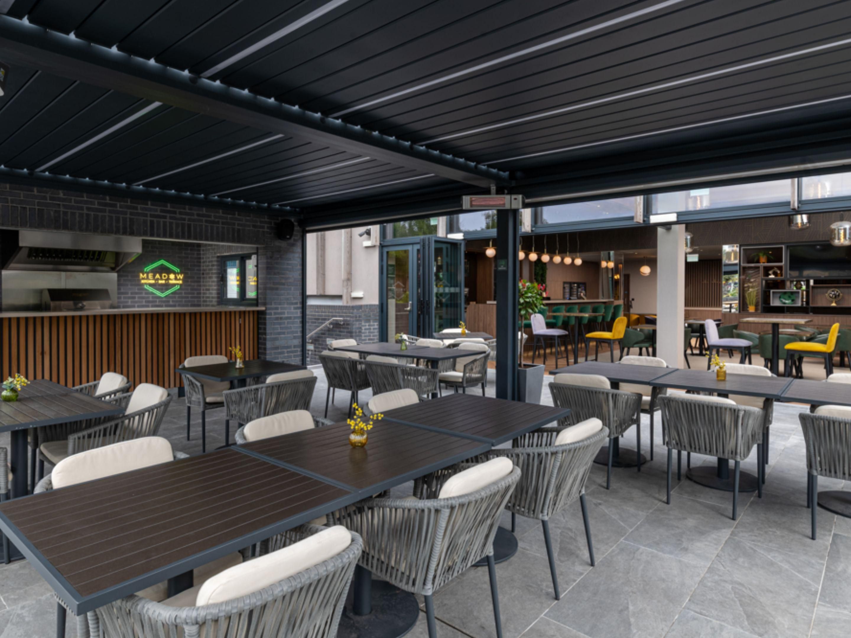 Step through the bi-folding doors from our bar to our sun-soaked terrace, the perfect spot to relax on a warm day. Enjoy a drink or some alfresco dining while soaking up the sunshine. In summer, we fire up our BBQ and pizza oven, serving delicious pizzas and grilled dishes.

Whether you're a hotel guest or a local, everyone is welcome!