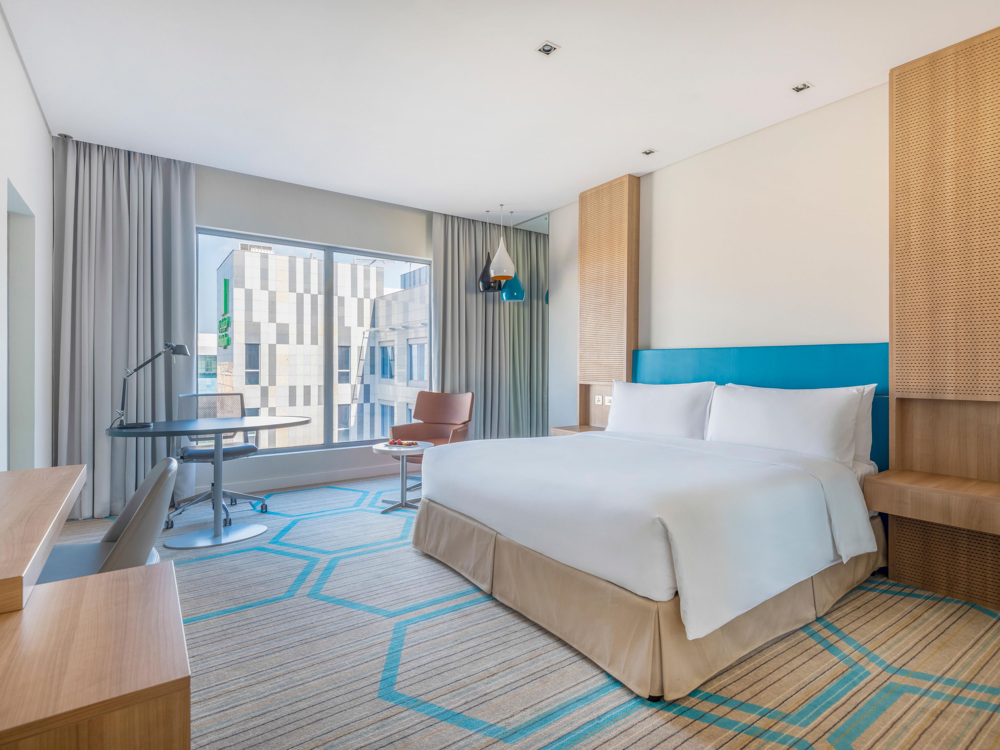 Spacious bedroom in our executive suite overlooking downtown Doha