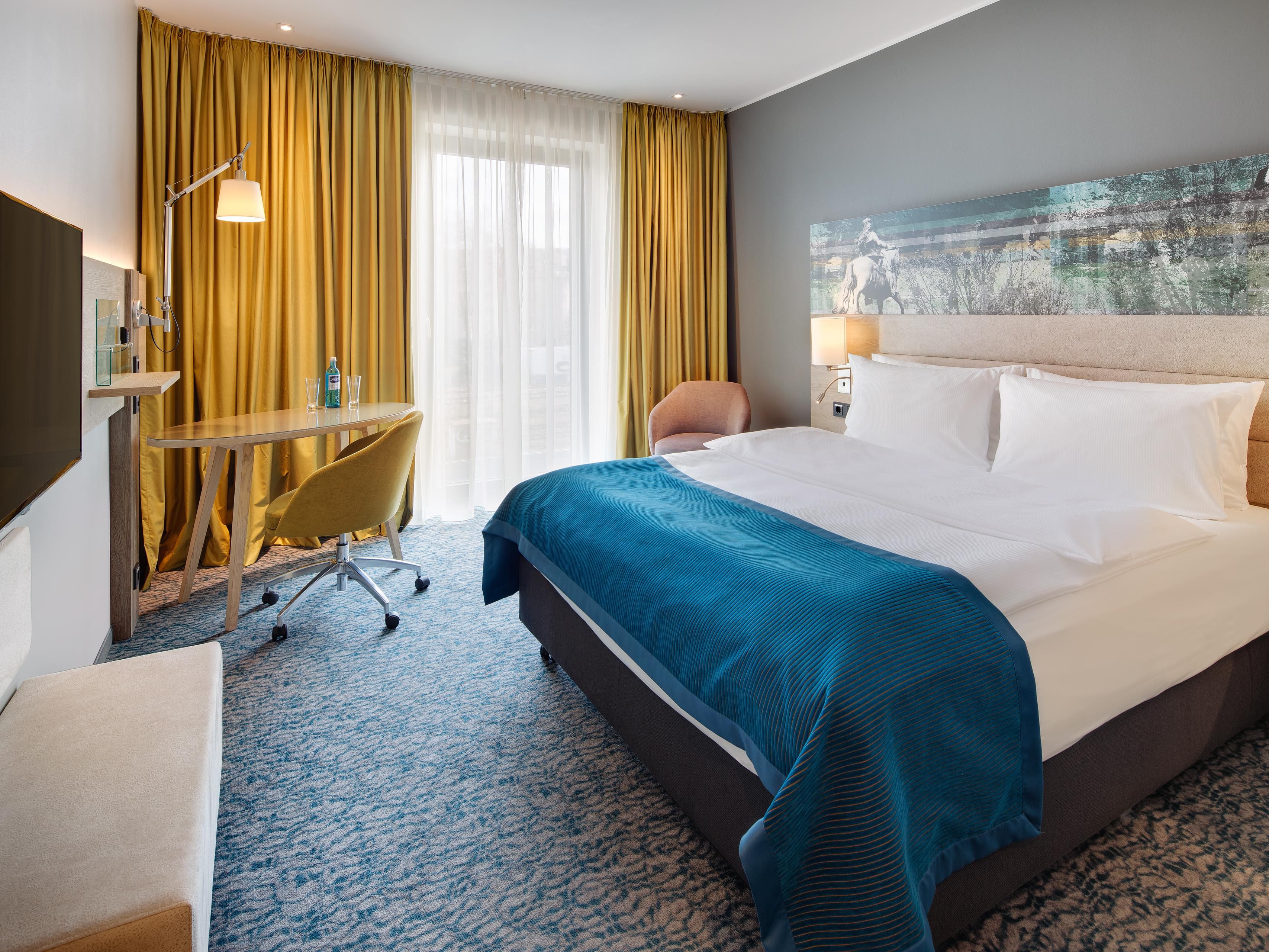 Rooms combine eye-catching images with understated tones.