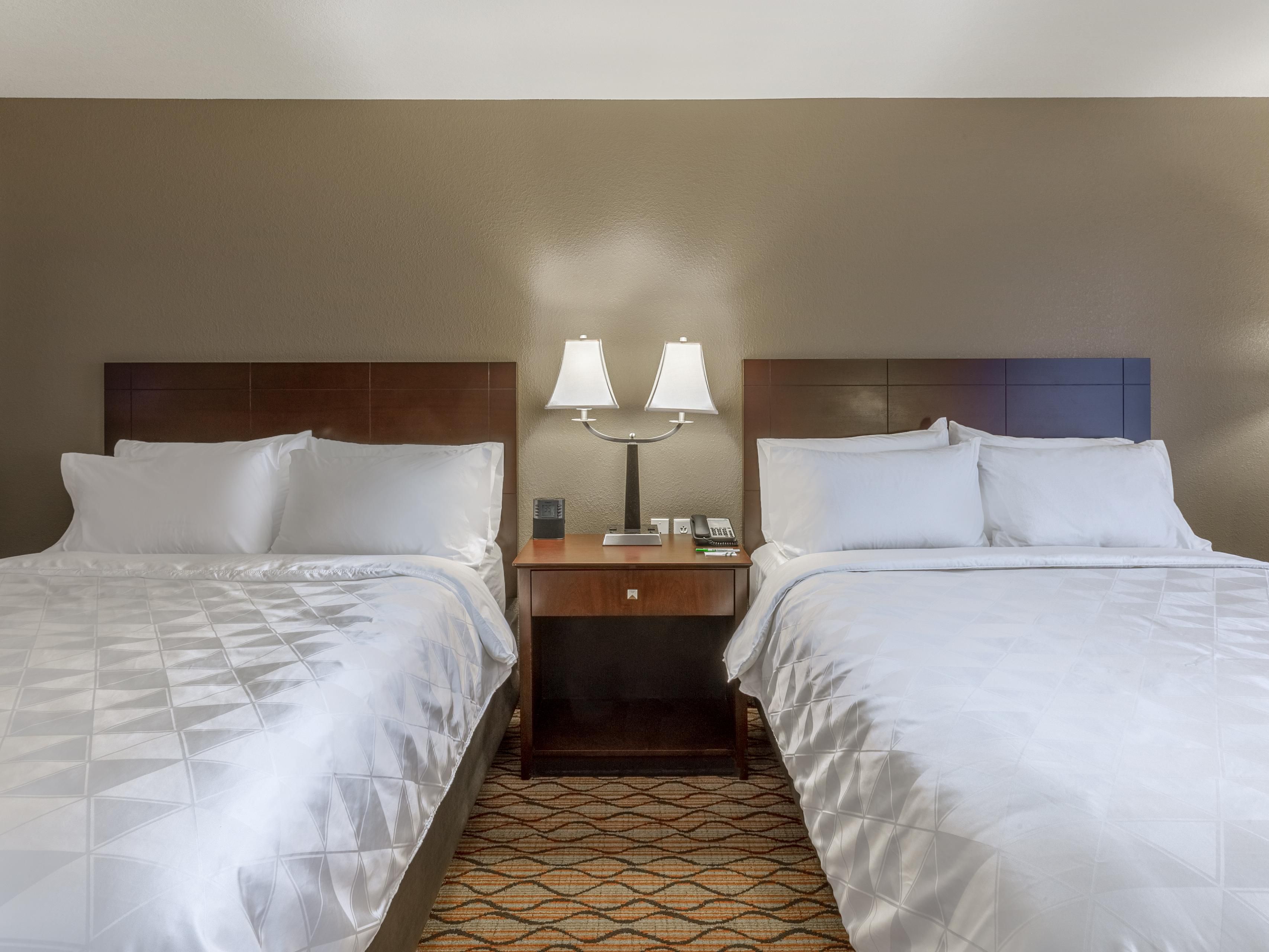 Our clean, comfortable Two Queen Rooms are perfect for teams