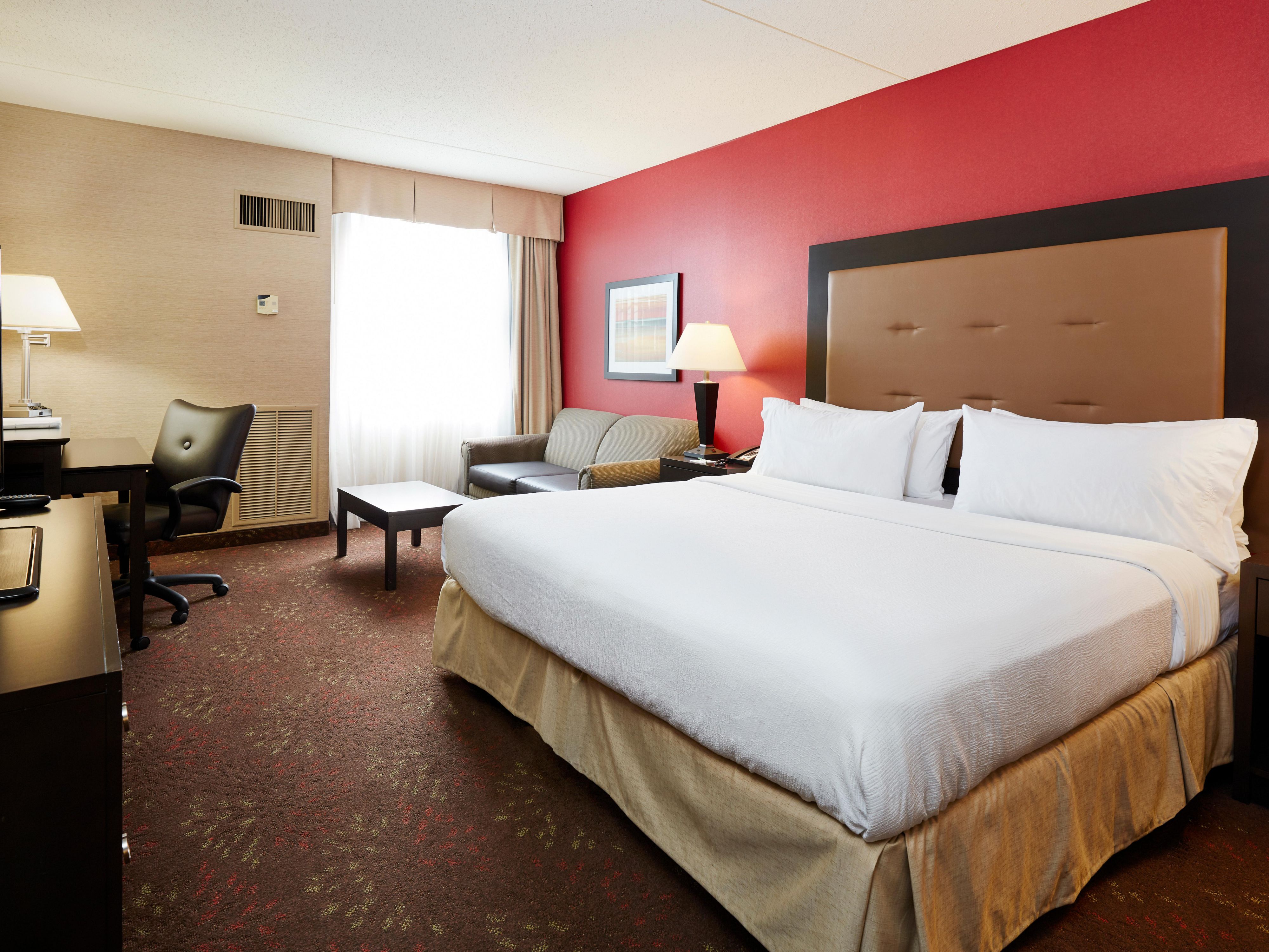 Plug in, stretch out, and get comfortable with free Wi-Fi, a flat-screen TV, a desk, and a mini-fridge for snacks and drinks. Whether you’re headed to one of the many wedding venues near Cincinnati, Ohio, or booking a hotel near CVG Airport with shuttle, our amenities are built for a smooth, comfortable stay.