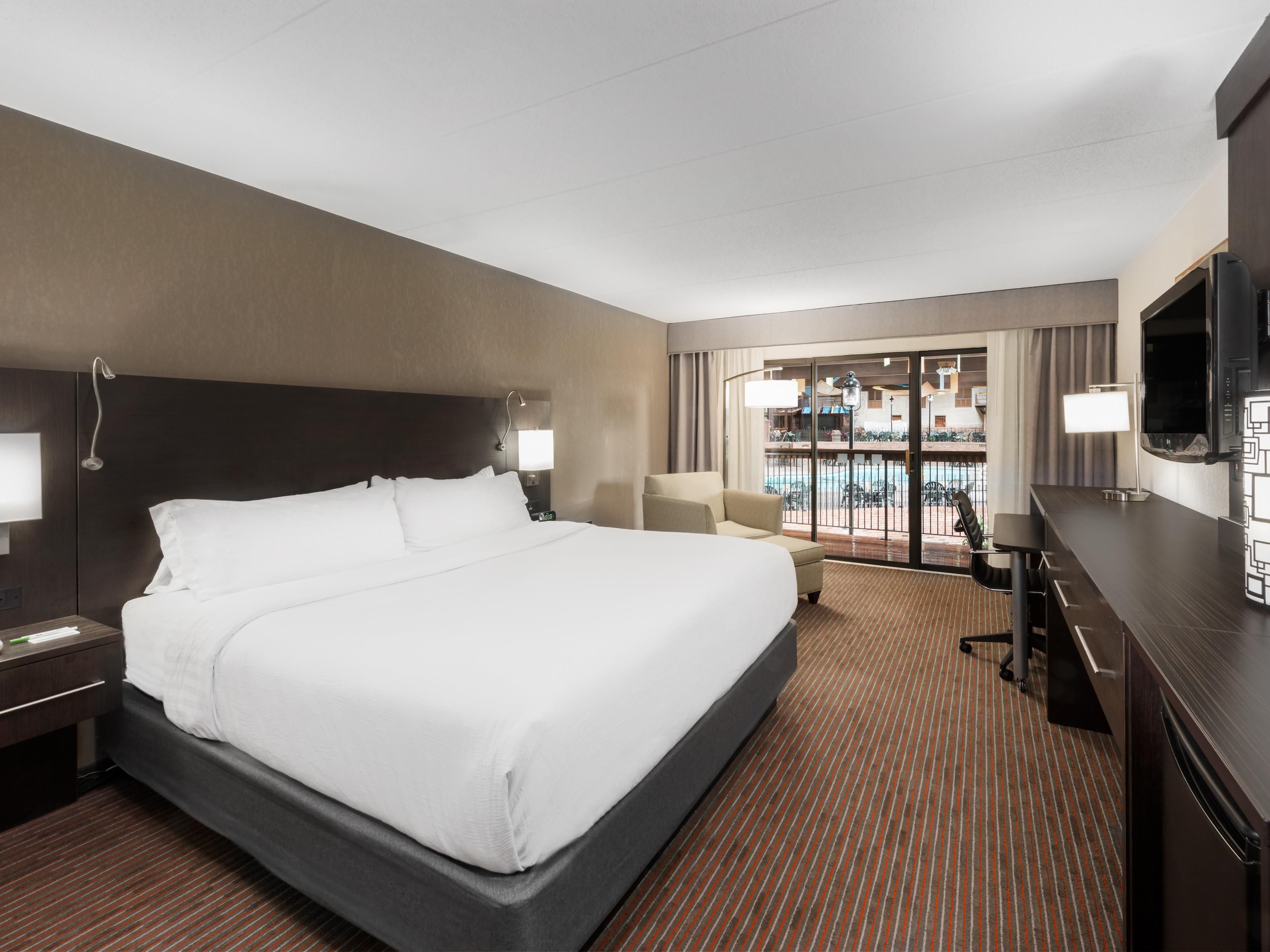 King Bed Room with Walkout & view of the indoor pool and Fundome.