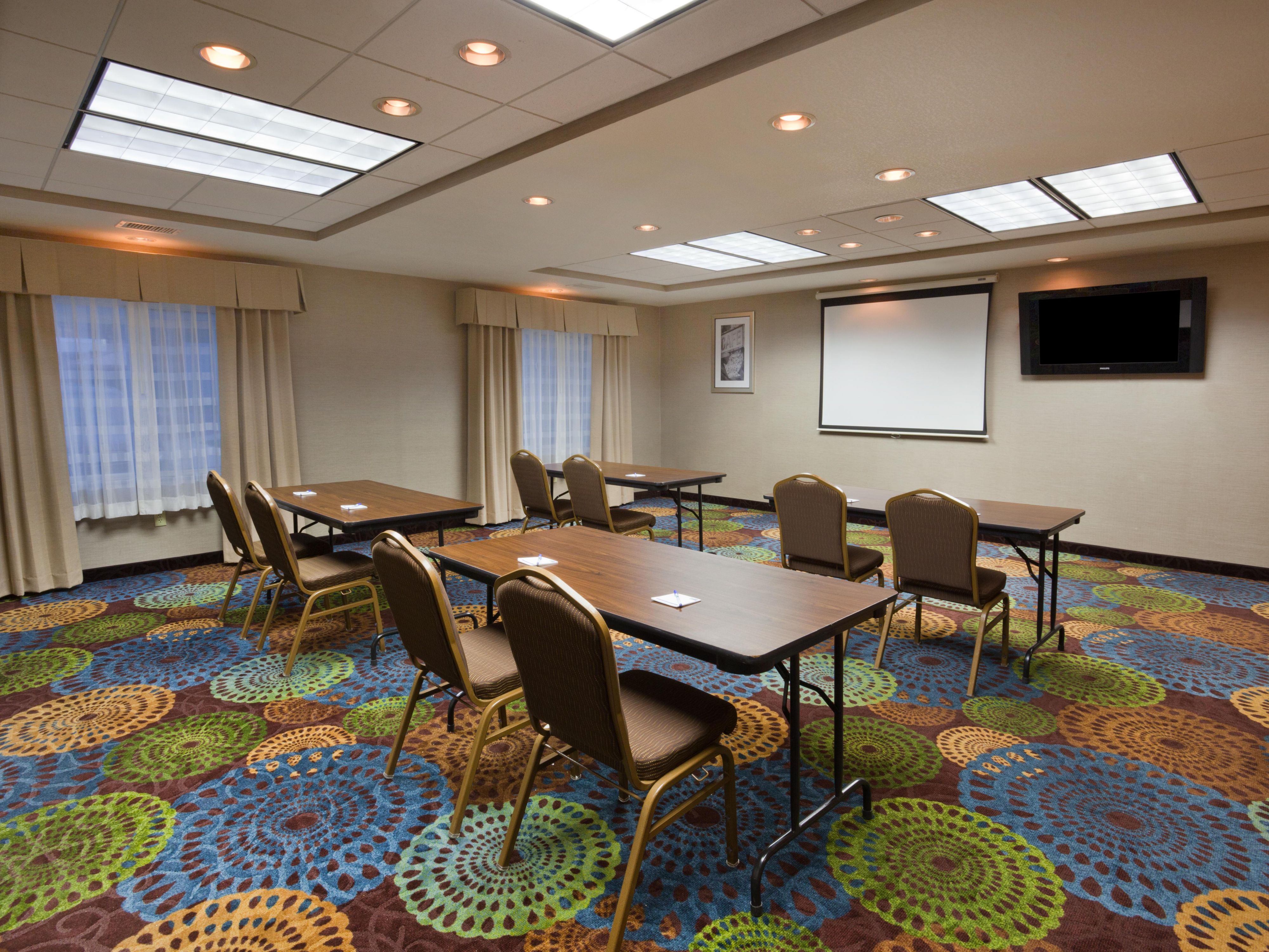 Plan your next event and meeting with us. Our event space provides 720 sq ft of flexible space. Displayed, is a classroom set-up. However, our hotel staff will provide a space to suit your needs, from banquets to presentations, we will accommodate. Our meeting room can even be used to prepare for an event at the attached Dakota Event Center.   