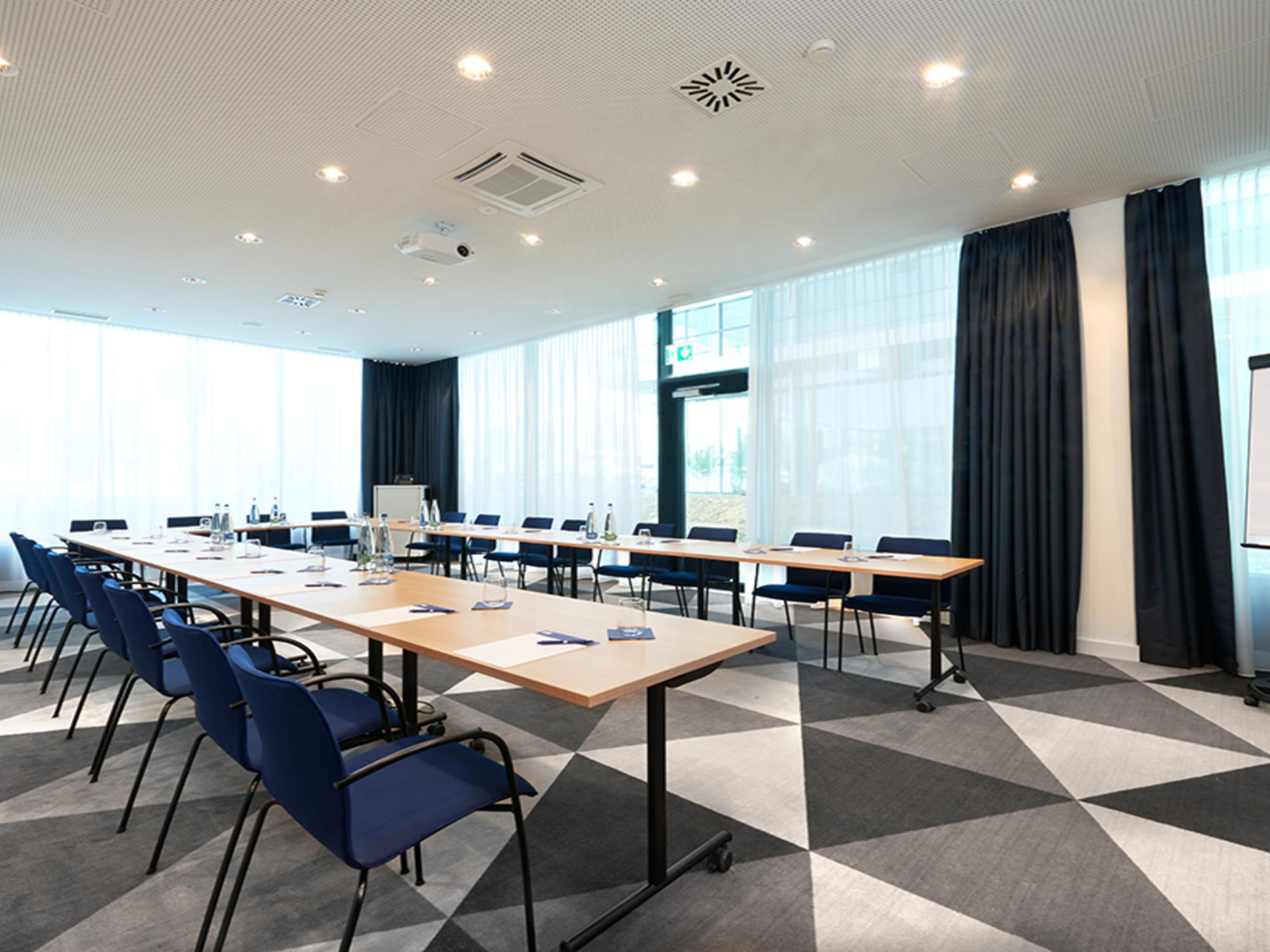 Host team trainings or seminars in our 53 sqm meeting room for up to 25 delegates. With natural daylight, flip charts, digital projectors and modern amenities, this bright space ensures a productive environment for seamless presentations.