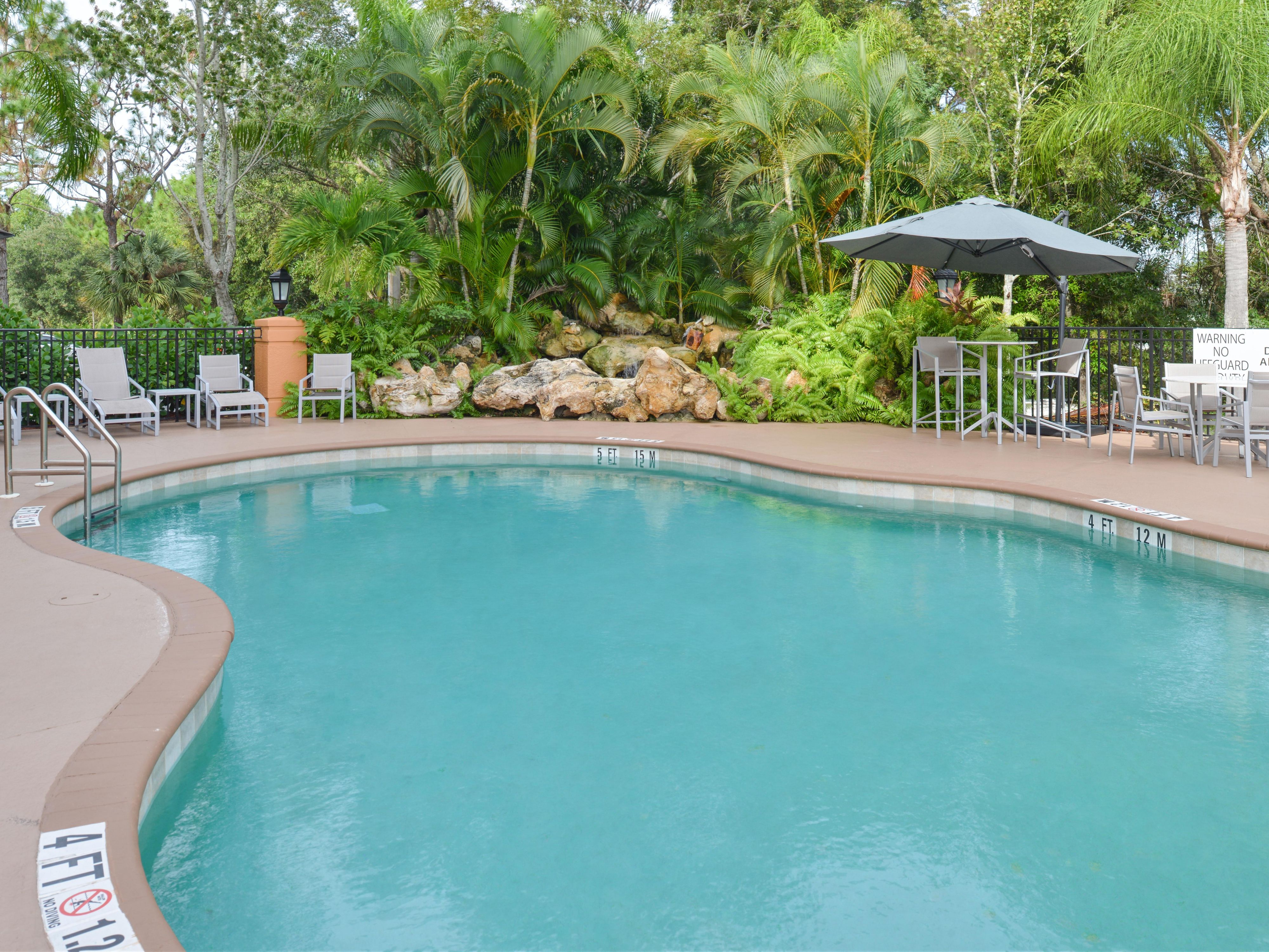 Open from dawn to dusk, relax in the Florida sunshine in our outdoor oasis. Read a book, take few laps, and enjoy the serenity complete with a bubbling waterfall.