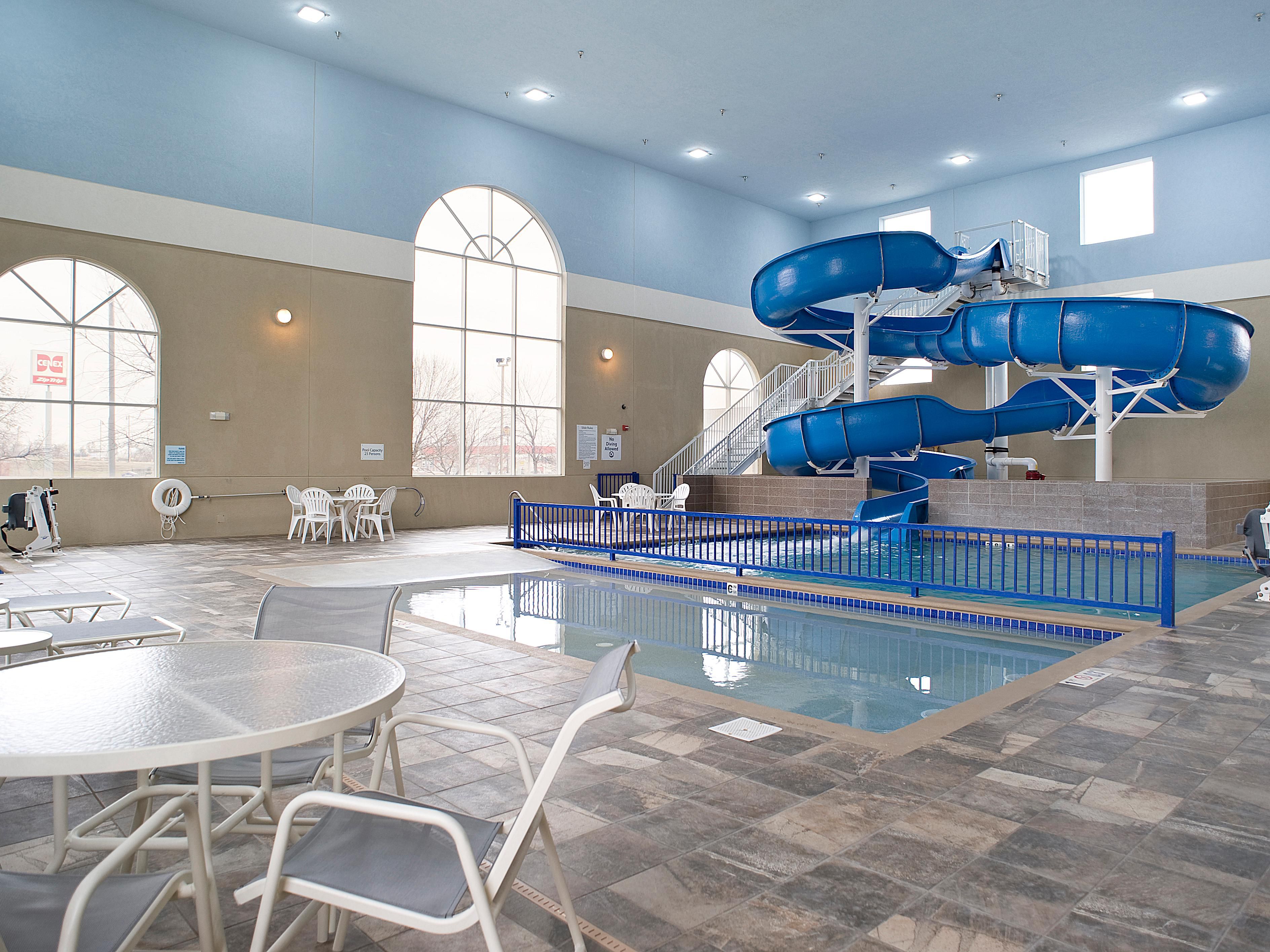 Splash into fun at our hotel pool with an exciting slide.