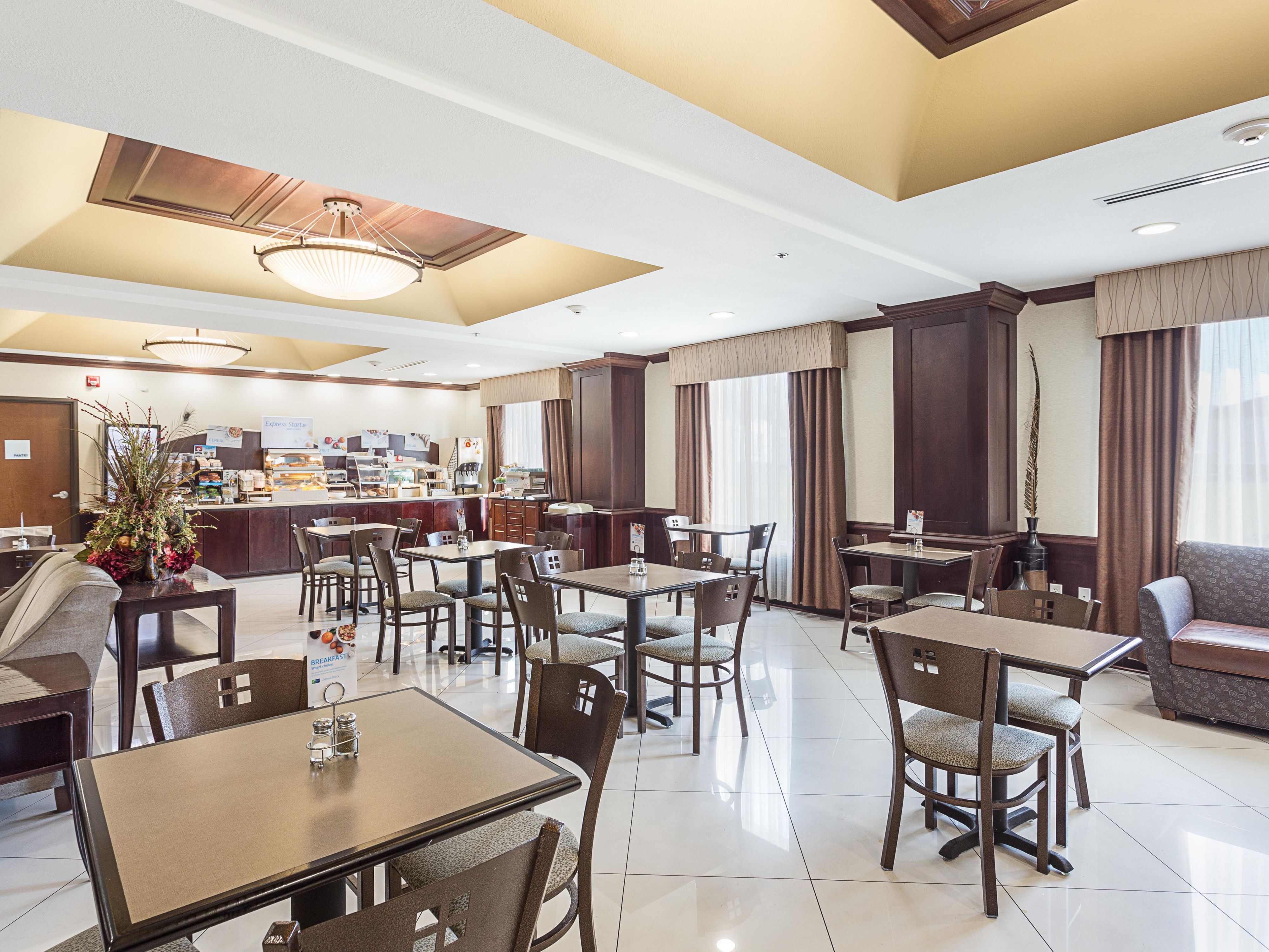 Our complimentary Express Start Breakfast bar offers a wide variety of hot & cold options including a rotation of egg & meat selections, biscuits or muffins, fruit, our famous cinnamon rolls & Smart Roast coffee.  Did we mention our one-touch pancake machine or our freshly cooked oatmeal kettle? You have to see it for yourself!  