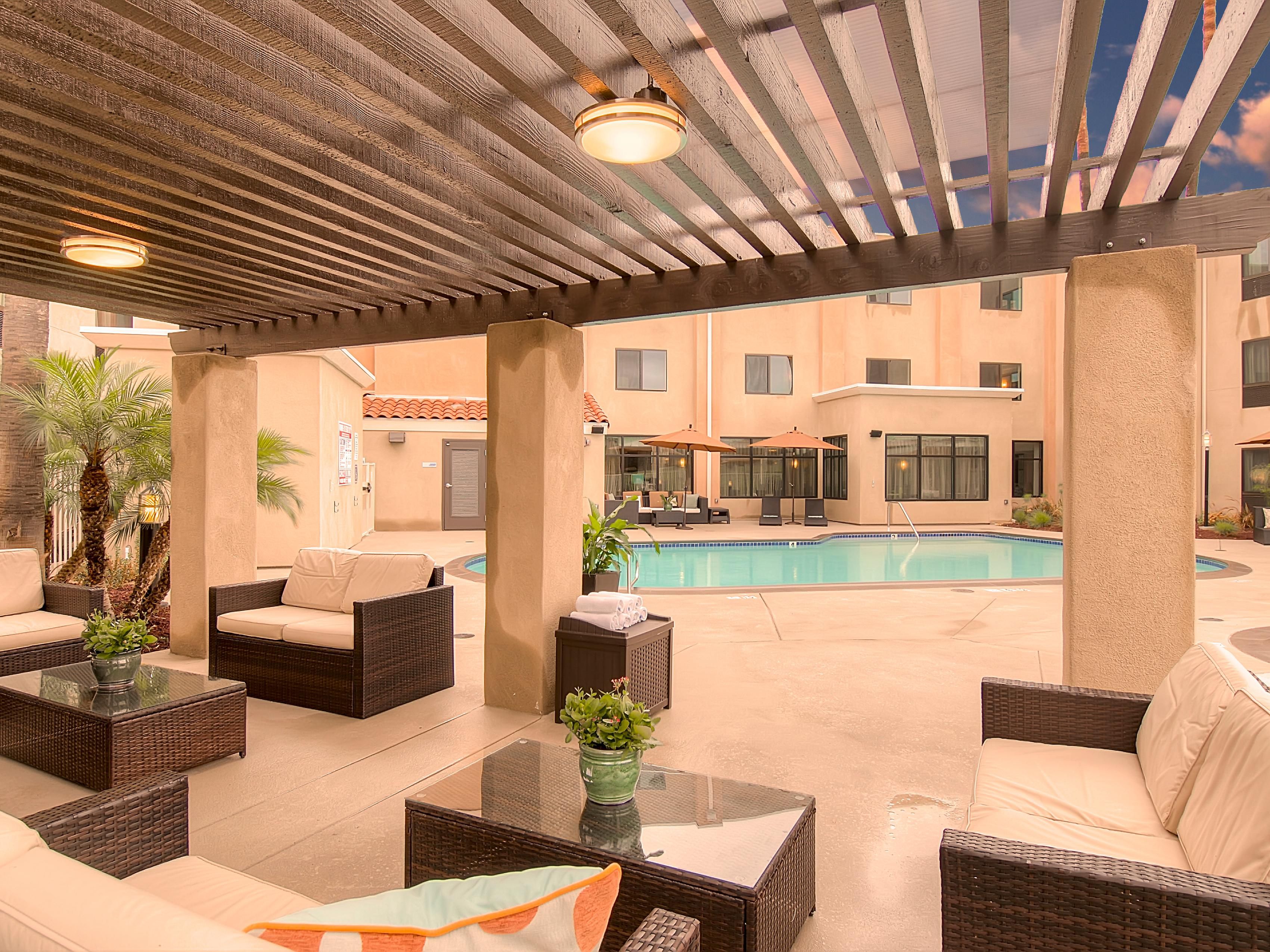 Take a dip in our outdoor pool and unwind on our spacious patio.