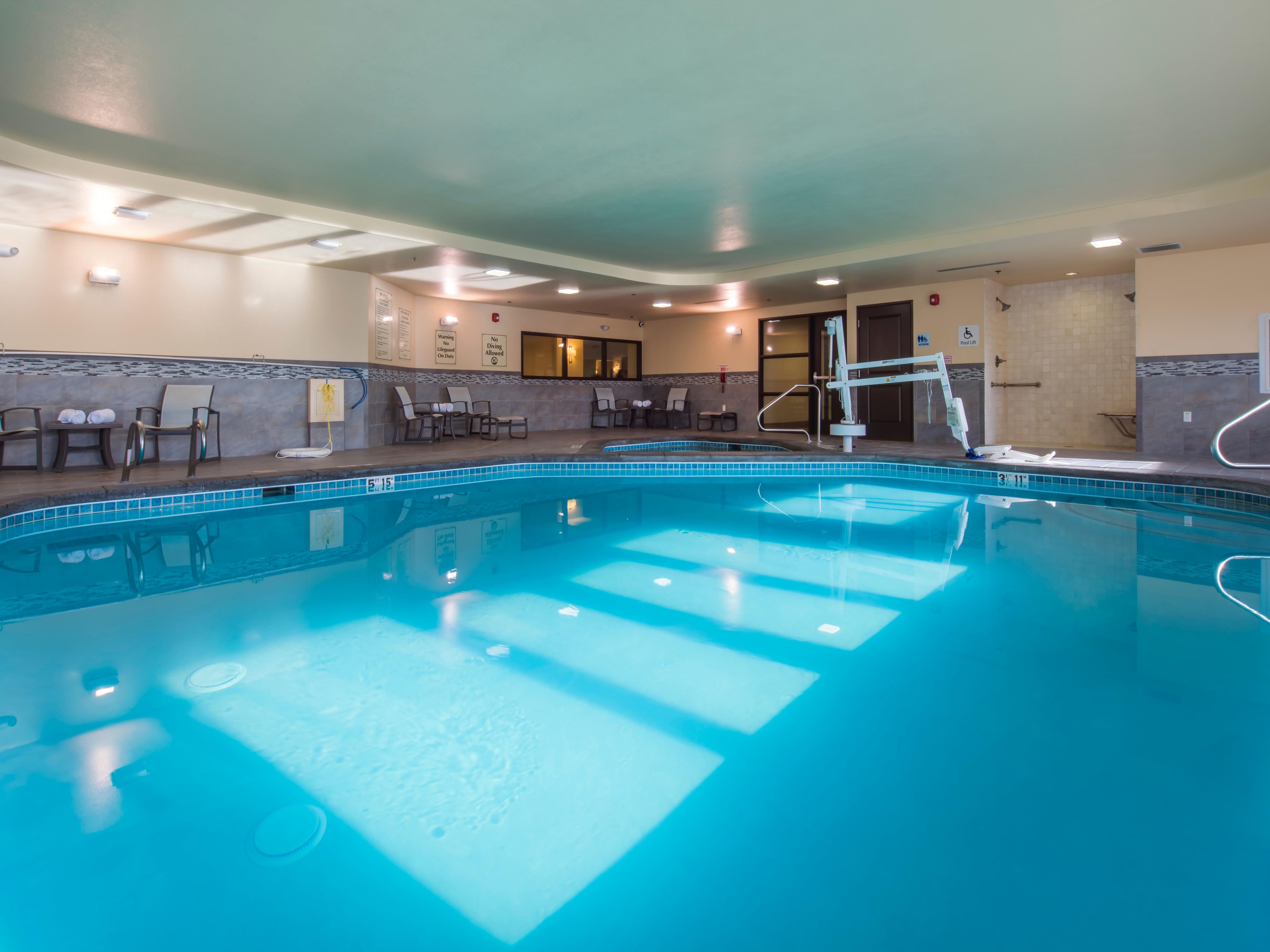 Dive into year-round relaxation at our indoor heated pool, open daily from 6 AM to 11 PM! Enjoy the warmth and comfort while lounging on poolside chairs, perfect for unwinding after a day of adventure. Our towel service ensures you have everything you need, and for an extra touch of relaxation, indulge in our soothing whirlpool tub. 