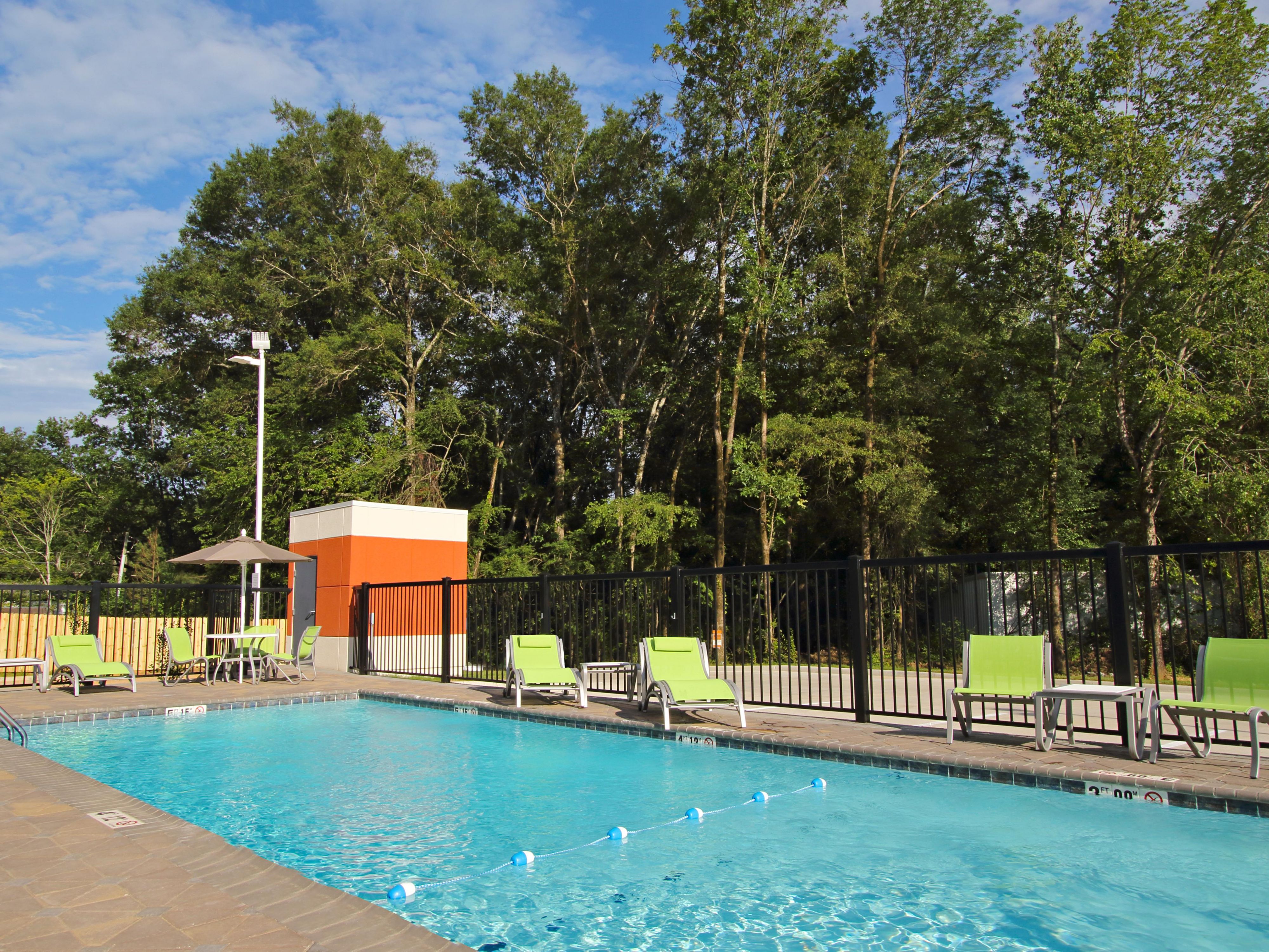 Relax in our outdoor pool during the hotter months, or read a favorite book in a poolside lounge chair. With large, mature trees overlooking the pool area, enjoy the sounds of nature while you relax. Whether you’re traveling solo or with the family, our outdoor pool is a welcoming space to rejuvenate your senses.   