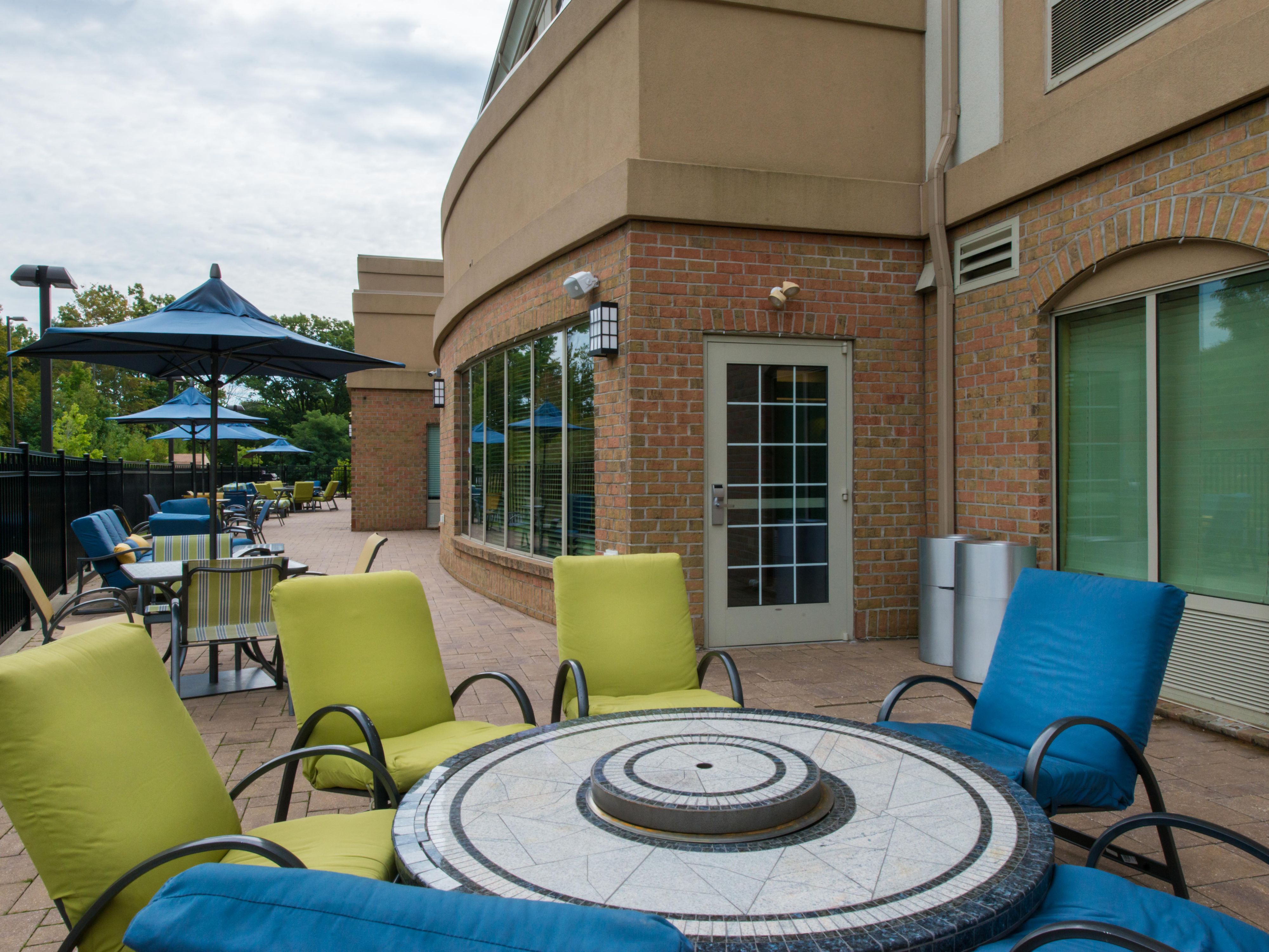Our hotel features a large outdoor patio with plenty of seating. The patio has two large fire-pit tables, couches, and dining tables. We offer a gas grill for guest use. There are also complimentary games available such as corn hole and connect four.