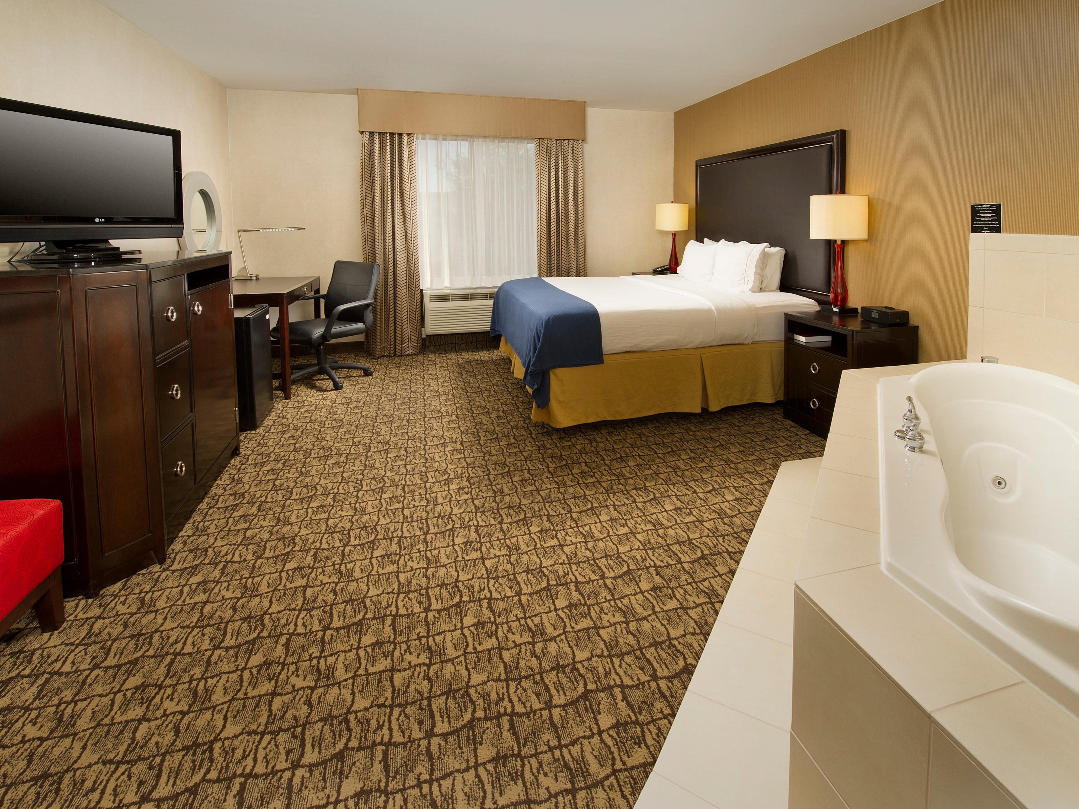 Come enjoy our King Whirlpool Suite, equipped with one king bed, a jetted tub, complimentary  Wi-Fi access, 55" LCD TV, work desk with an ergonomic chair, mini-fridge, coffee pot, hair dryer, iron and ironing board.