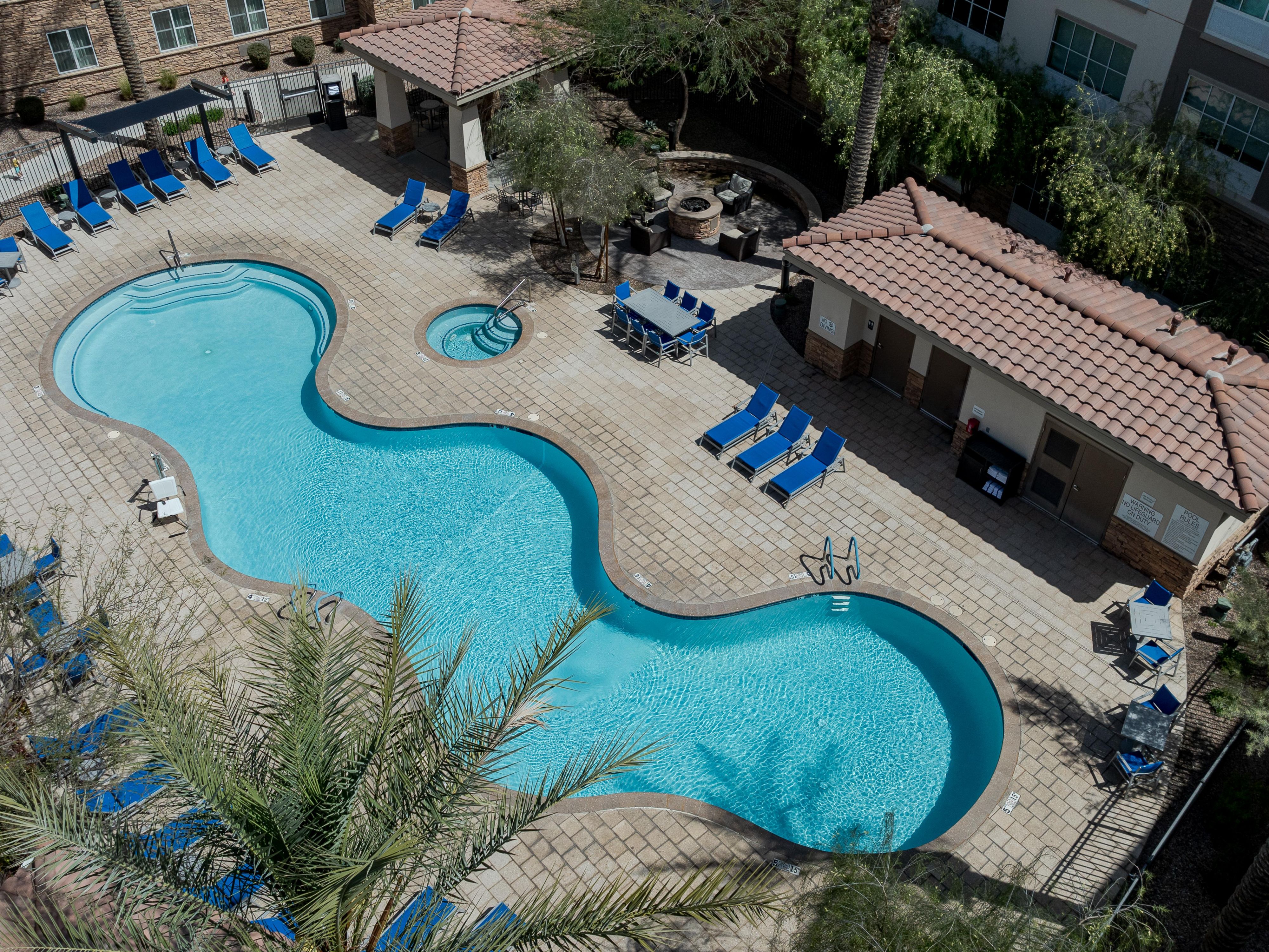Our beautiful resort style swimming pool is located outdoors in the Arizona sunshine, and is open year round! With gas grills, a fire pit, and a hot tub available as well, you are sure to get the R&R you are looking for. 
