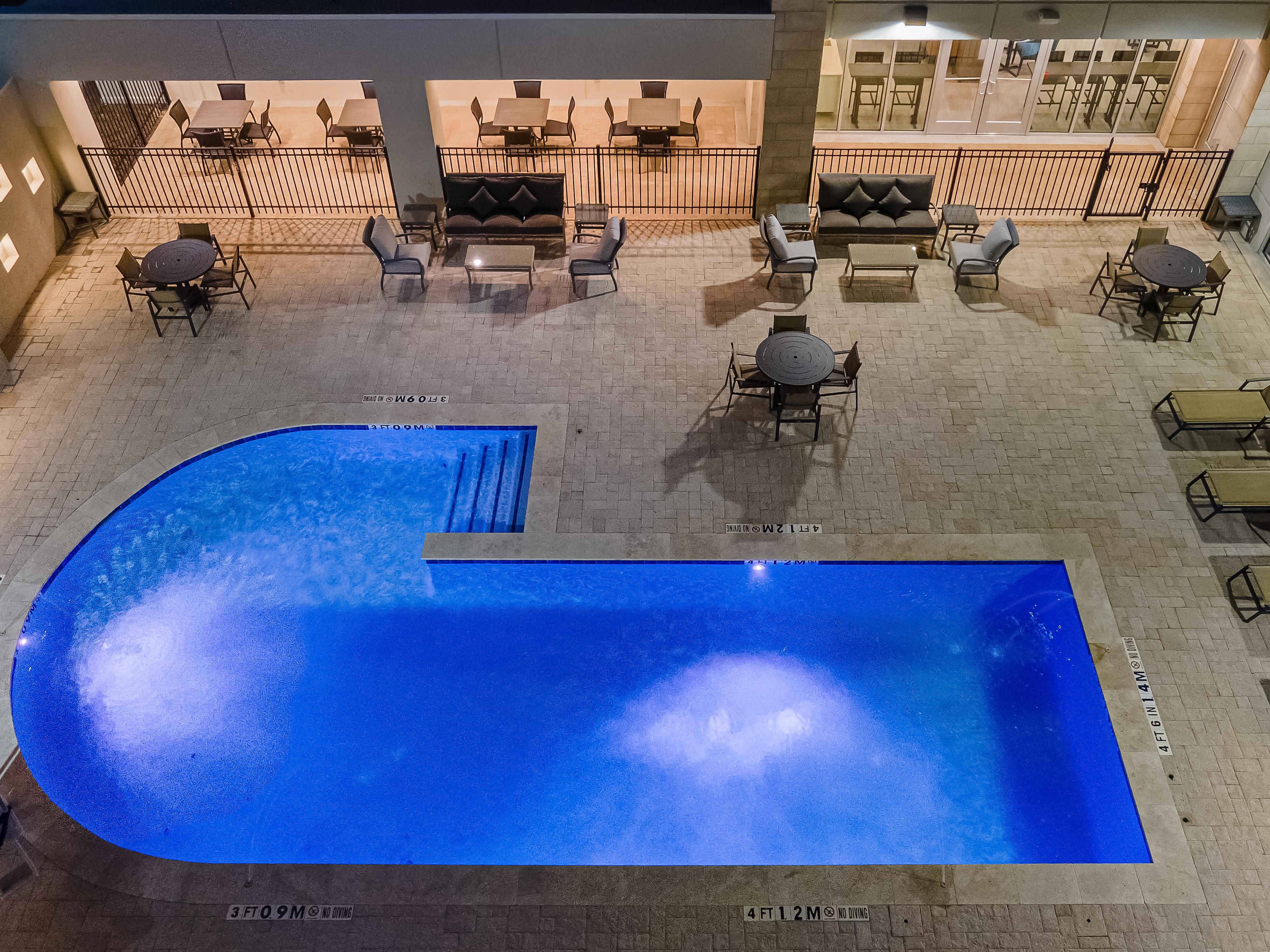 exterior swimming pool at dusk