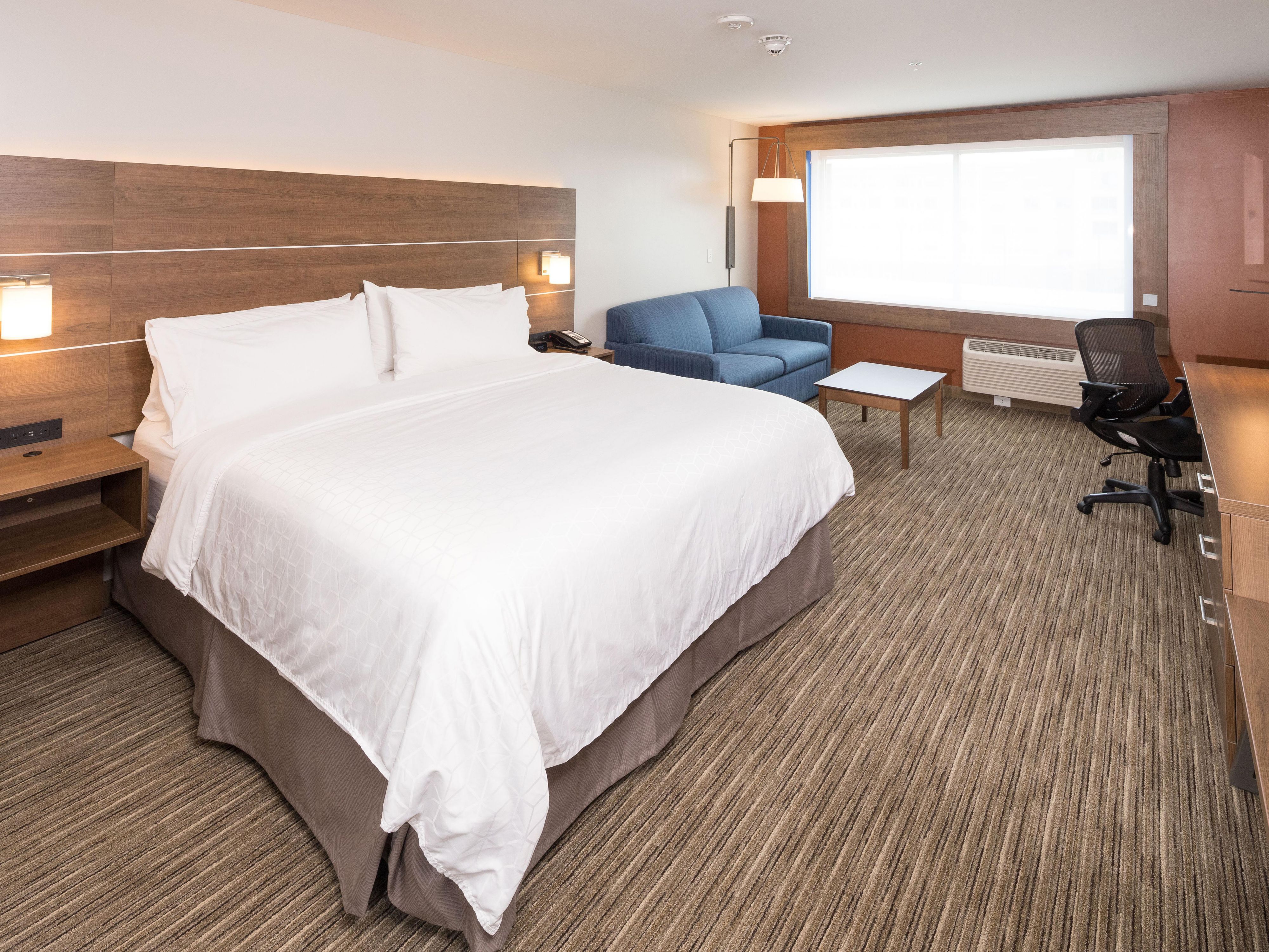 Relax in a king suite featuring pull out sofa sleeper and wet bar