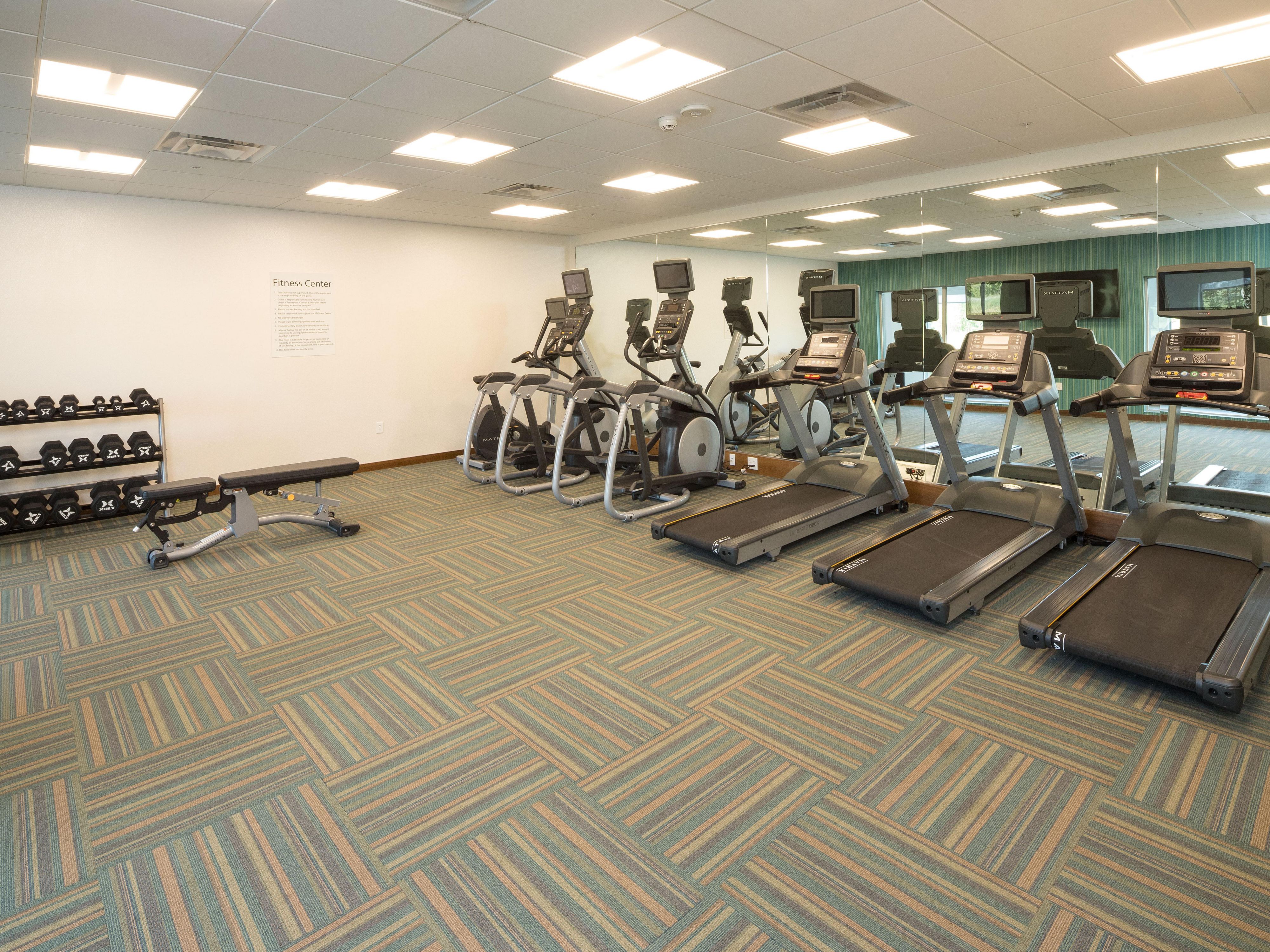 Start your day off feeling your best with our state of the art fitness center!  We are proud to have three treadmills, two elliptical machines, and a stationary bicycle that all include their own television screens so you can choose what you watch while you sweat!  Free weights and yoga mats are available in our open workout area.