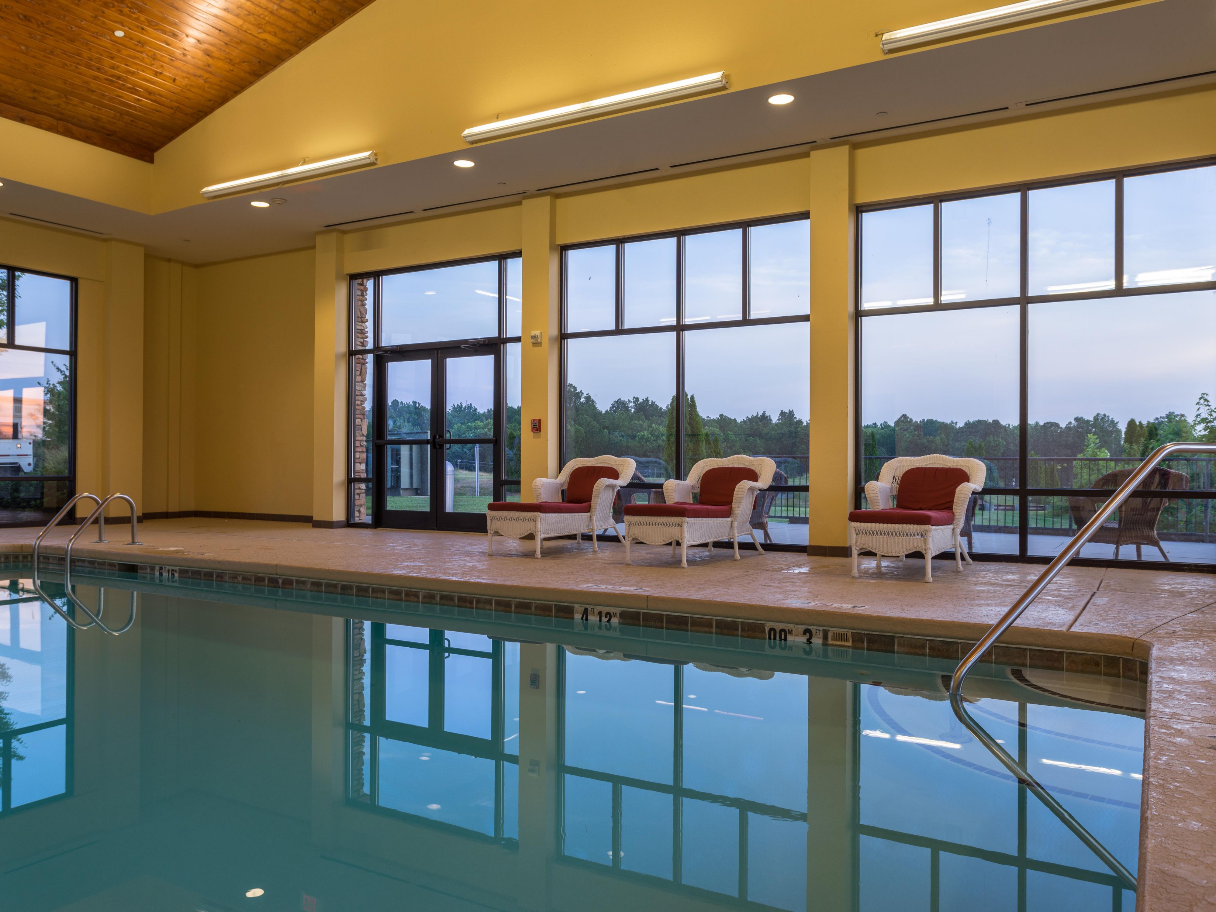 Step into a resort-style experience in our beautiful pool room. With vaulted ceilings, floor-to-ceiling windows overlooking the pastoral landscape, and stylish yet comfortable lounge chairs, our heated pool is a true retreat. Splash, soak, swim, and relax anytime between 9 AM and 10 PM!