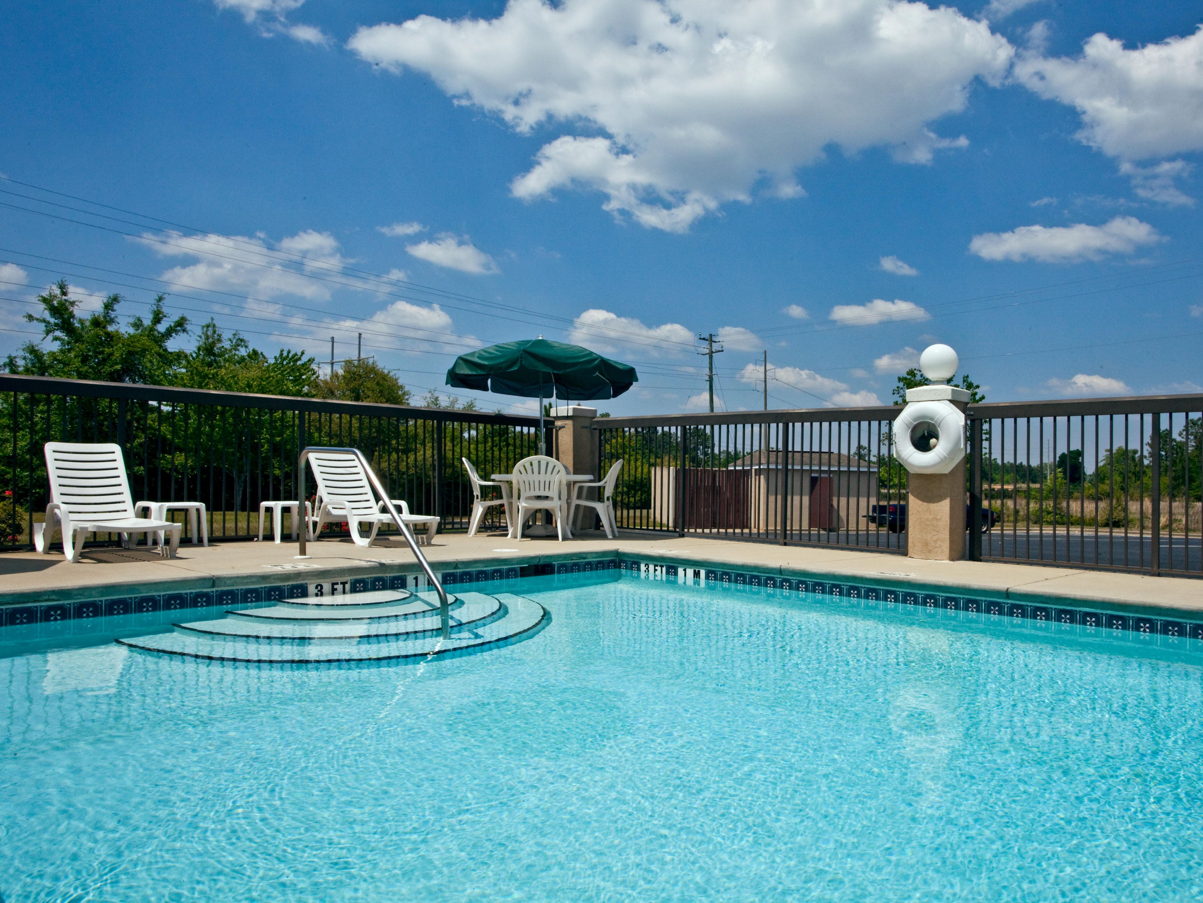 Bask in the sun by the warm, sparkling pool.