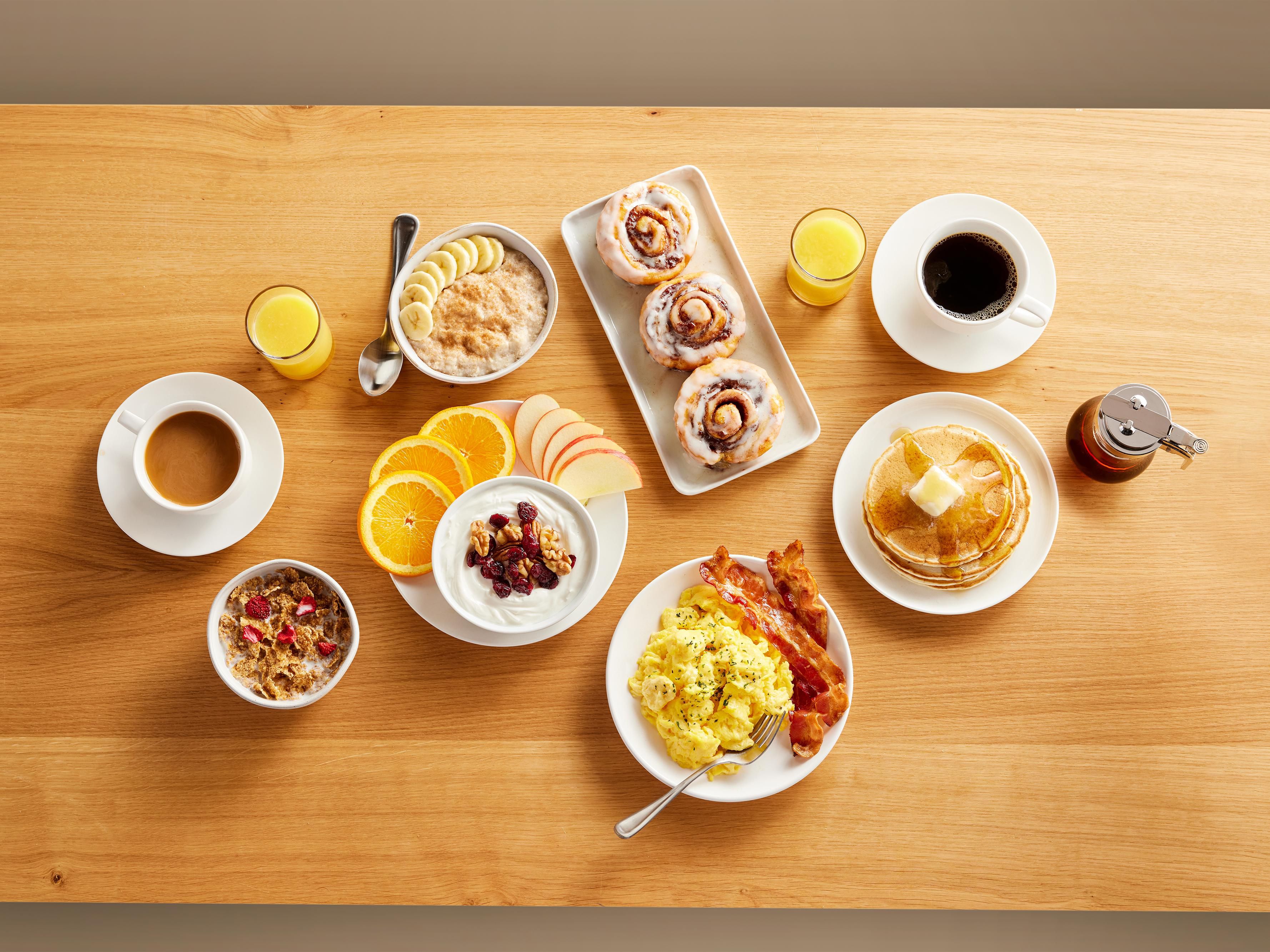 Our complimentary grab & go breakfast is a full, attendant-served buffet, featuring hot and cold items.
