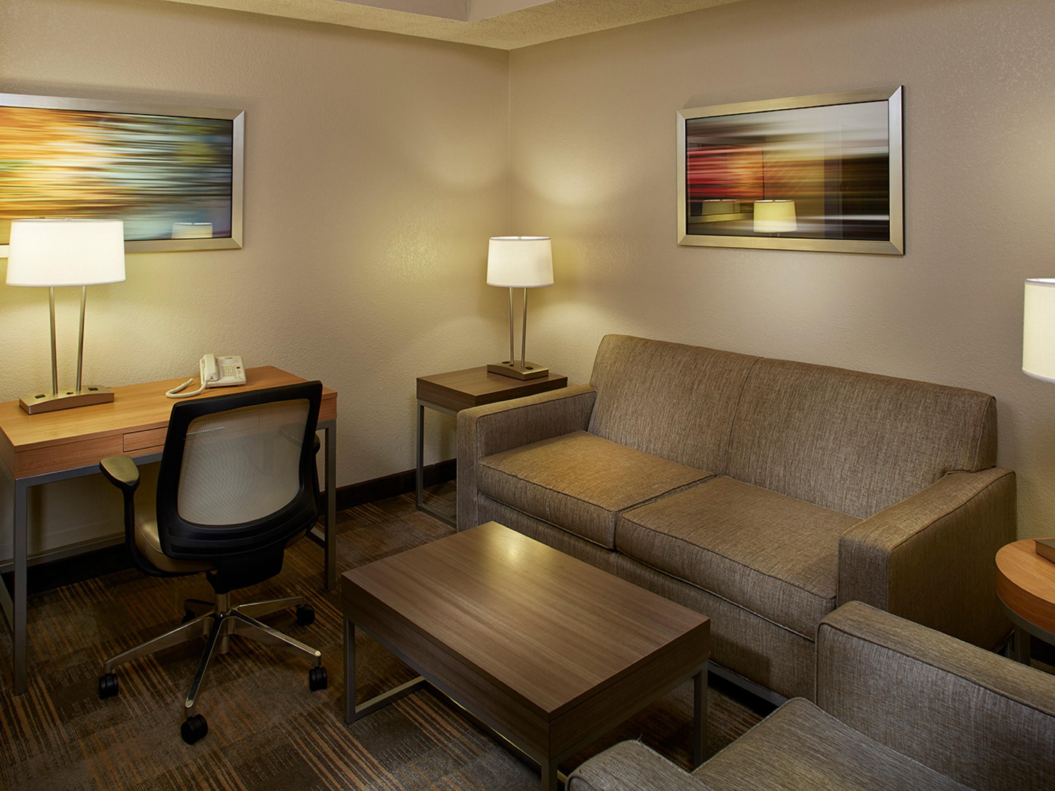 We offer 12 suites with two queen beds. All suites have a separated living room and bedroom area. Each area has a 40-inch TV and separated by a door. All suites have a couch and lounge chair. Refrigerator and microwave in the refreshment area are available for your convenience.
