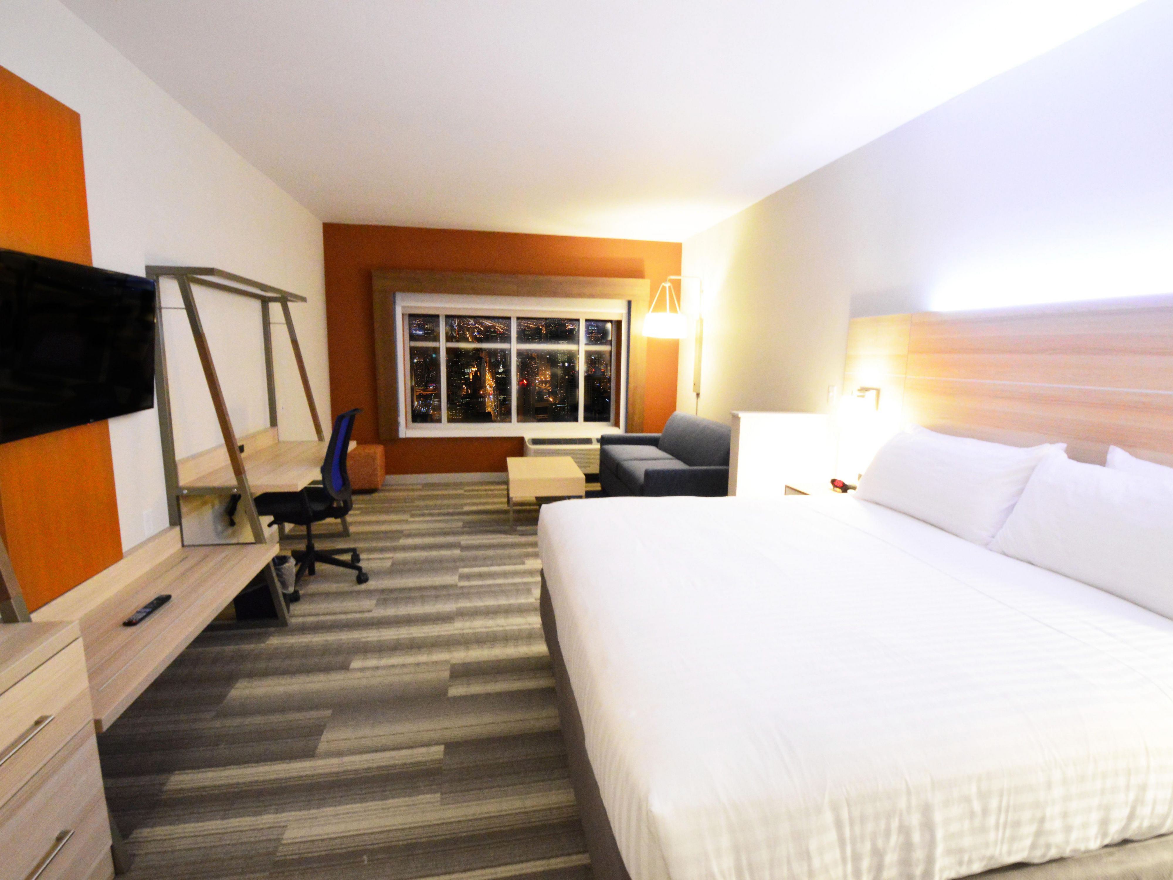 Relax and enjoy our spacious guestroom with couch.