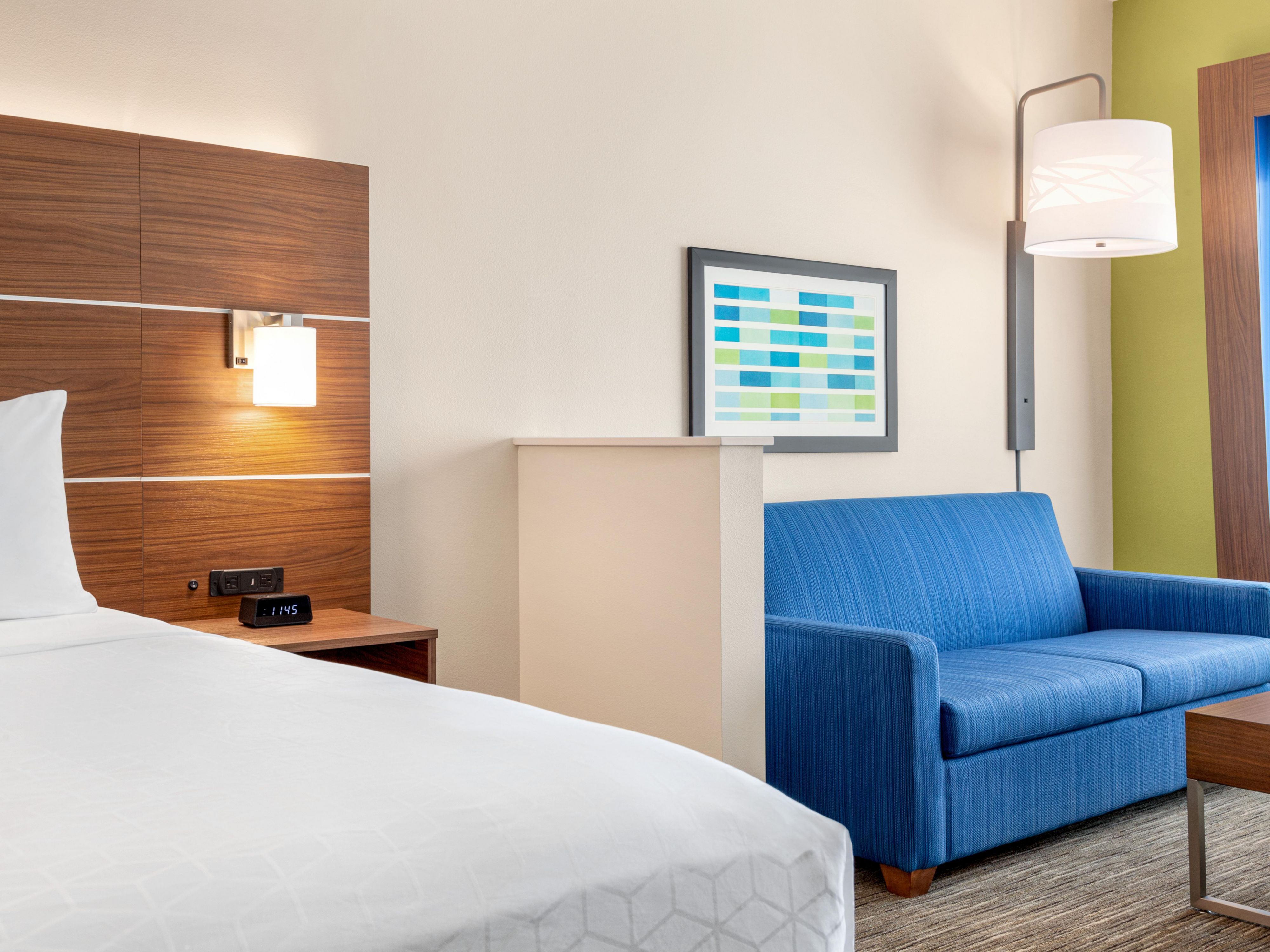 Book our roomy King Bed Suite with full-sized sleeper sofa