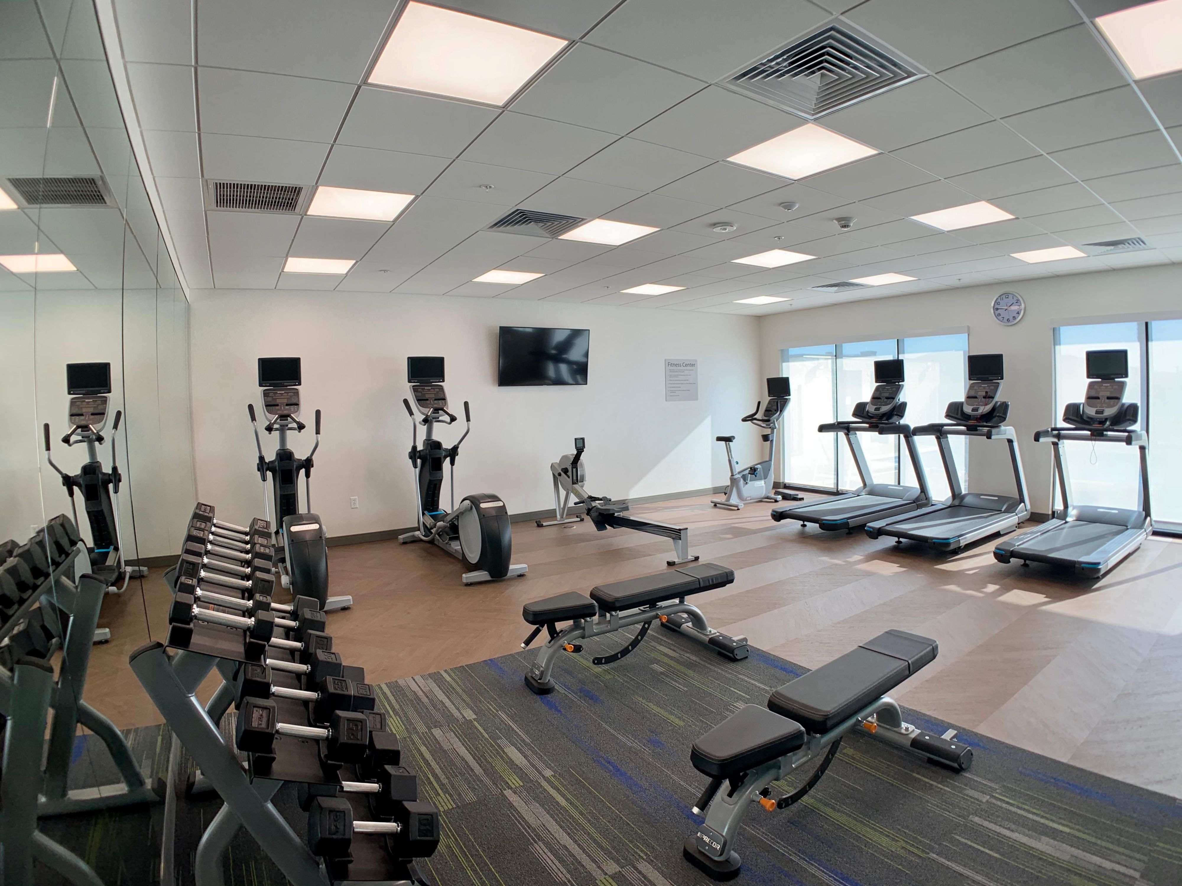 Stay fit while staying Smart. Our spacious fitness room features free weights, rowers, ellipticals, and treadmills. 