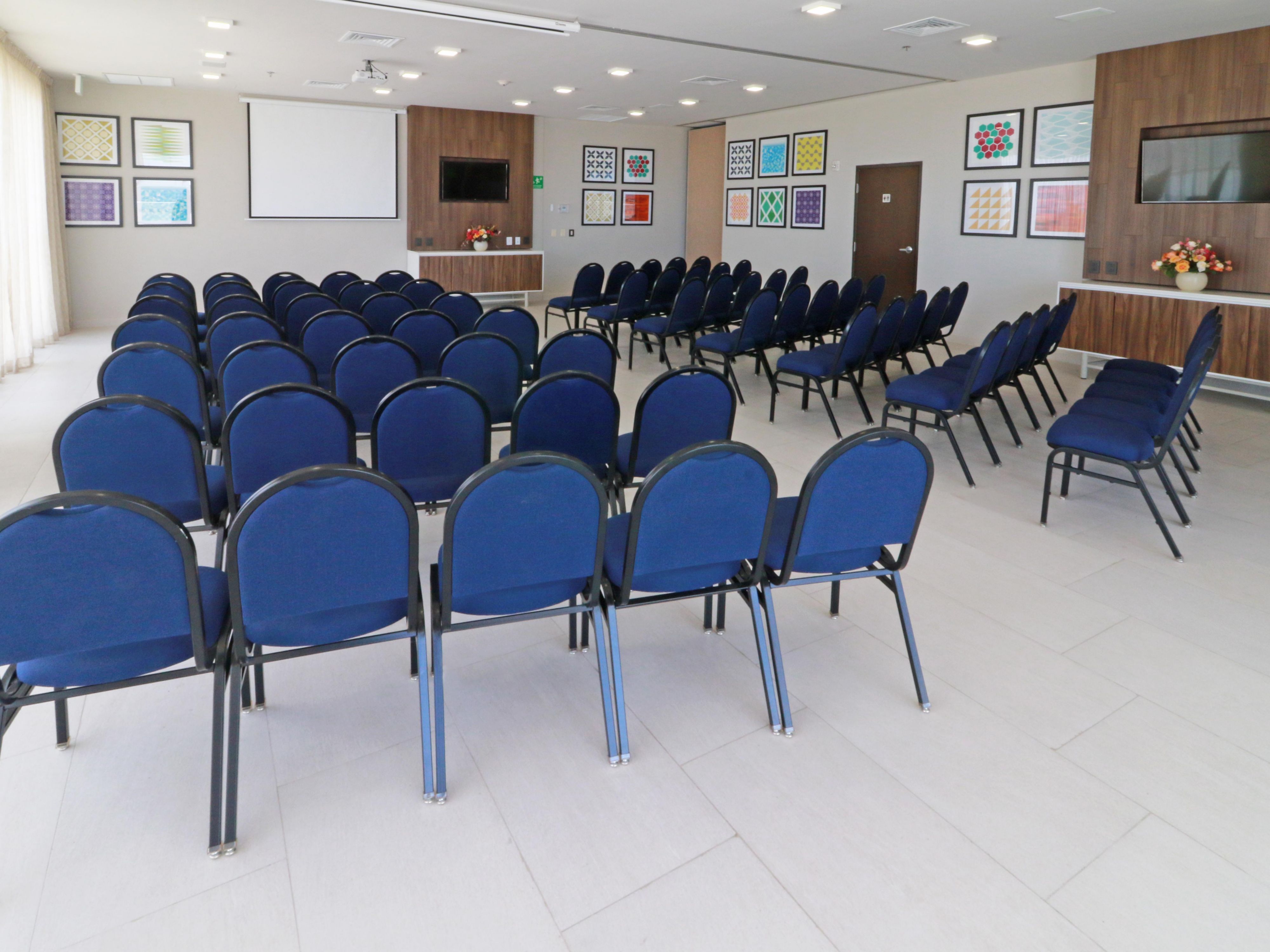 Host your next event on our scenic rooftop meeting space, featuring large windows with city views, a TV, and projector for seamless presentations. It's a bright, inspiring setting perfect for business gatherings, workshops, or private sessions with a view.